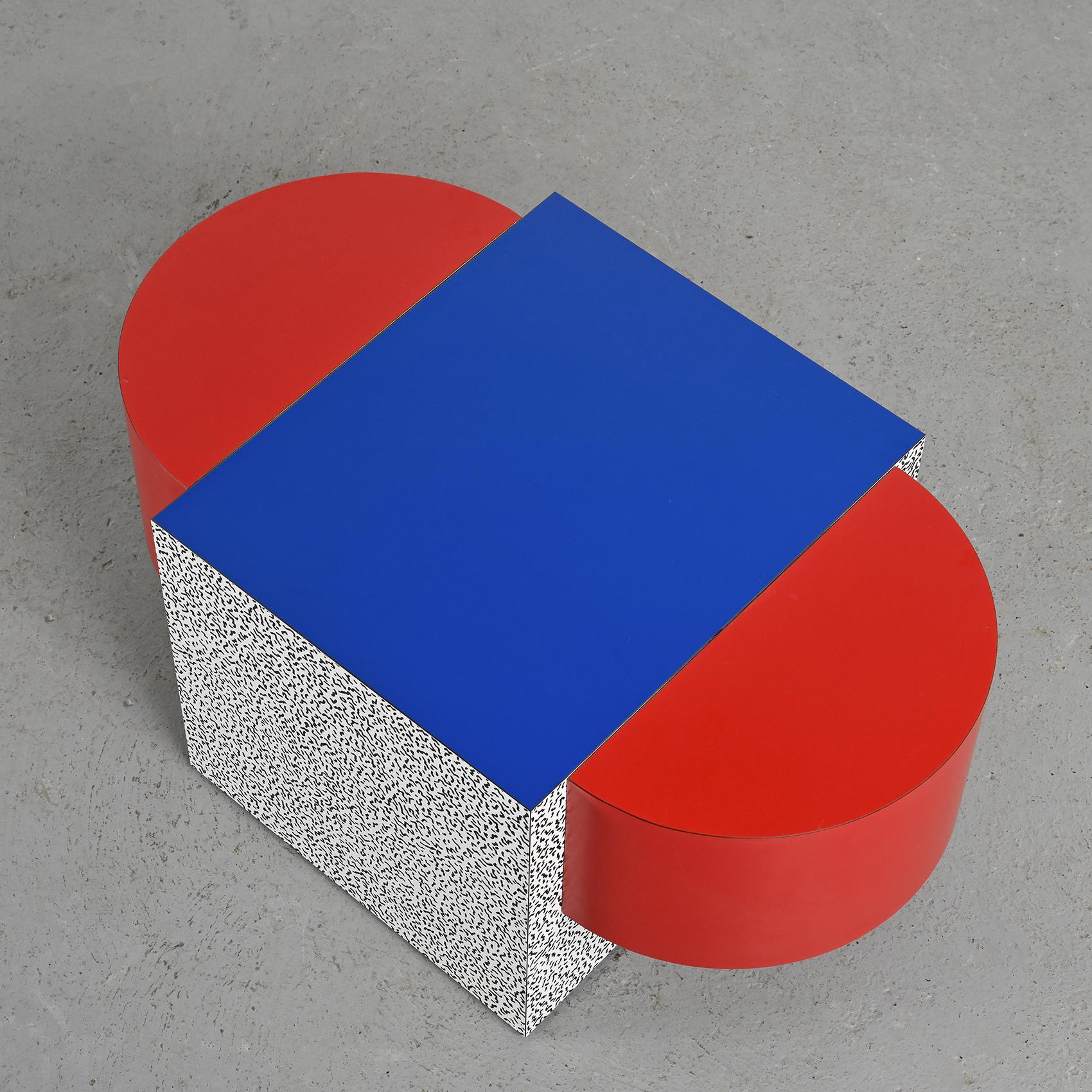 A beautiful example of Ettore Sottsass' work, the Table Tony No.3 was conceived by the renowned designer in 1979. This particular piece was published by Anthologie Quartett around 1990.

It is characterized by an oval tabletop surrounding a square,