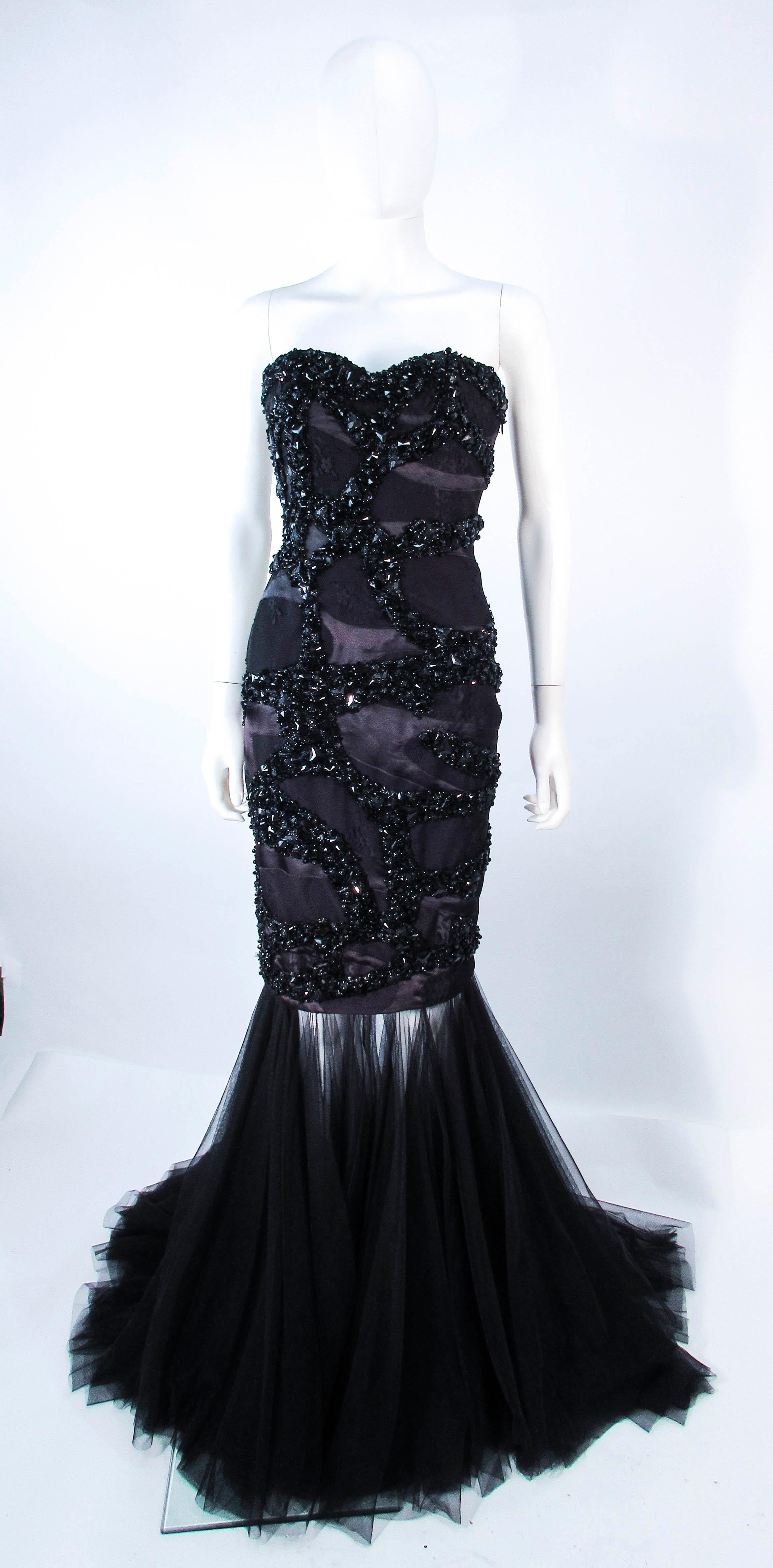 This is a wonderful Tony Ward design. This fabulous gown features a beaded and sequin strapless upper, with a detachable mesh skirt. Can be worn as a cocktail dress or gown. There is a zipper closure. In excellent pre-owned condition, some signs of