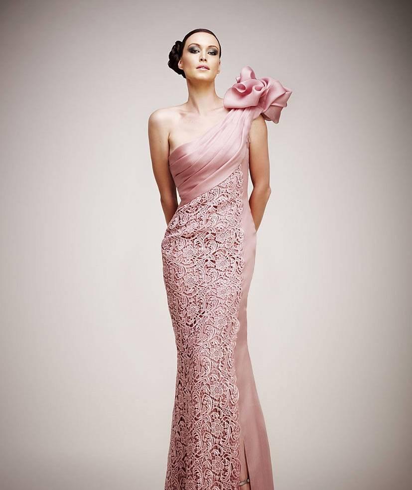 This gorgeous TONY WARD Spring 2011 Pret-A-Porter collection gown comes in a light mauve pink woven textured fabric and features a pleated ruched bodice, one shoulder with rhinestone crystal embellished ruffle puff detail, and lace overlay panel.