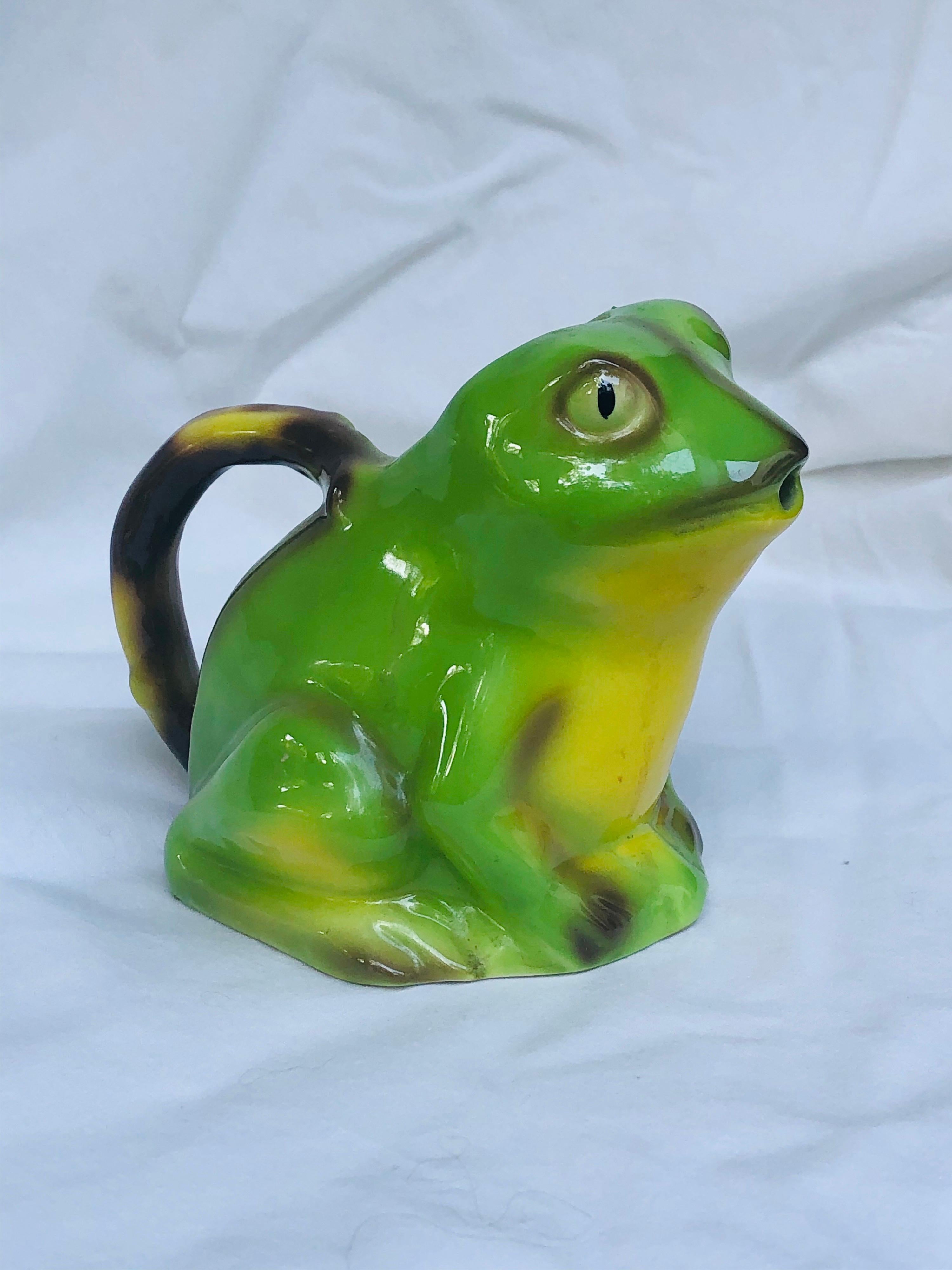 Quite rare Tony Wood green pottery frog creamer, circa 1982. England. Signed on the underside. Wood & Sons studio of Burslem, England, were known for their Toby Jugs and have been circa 1865. They have ceased production.