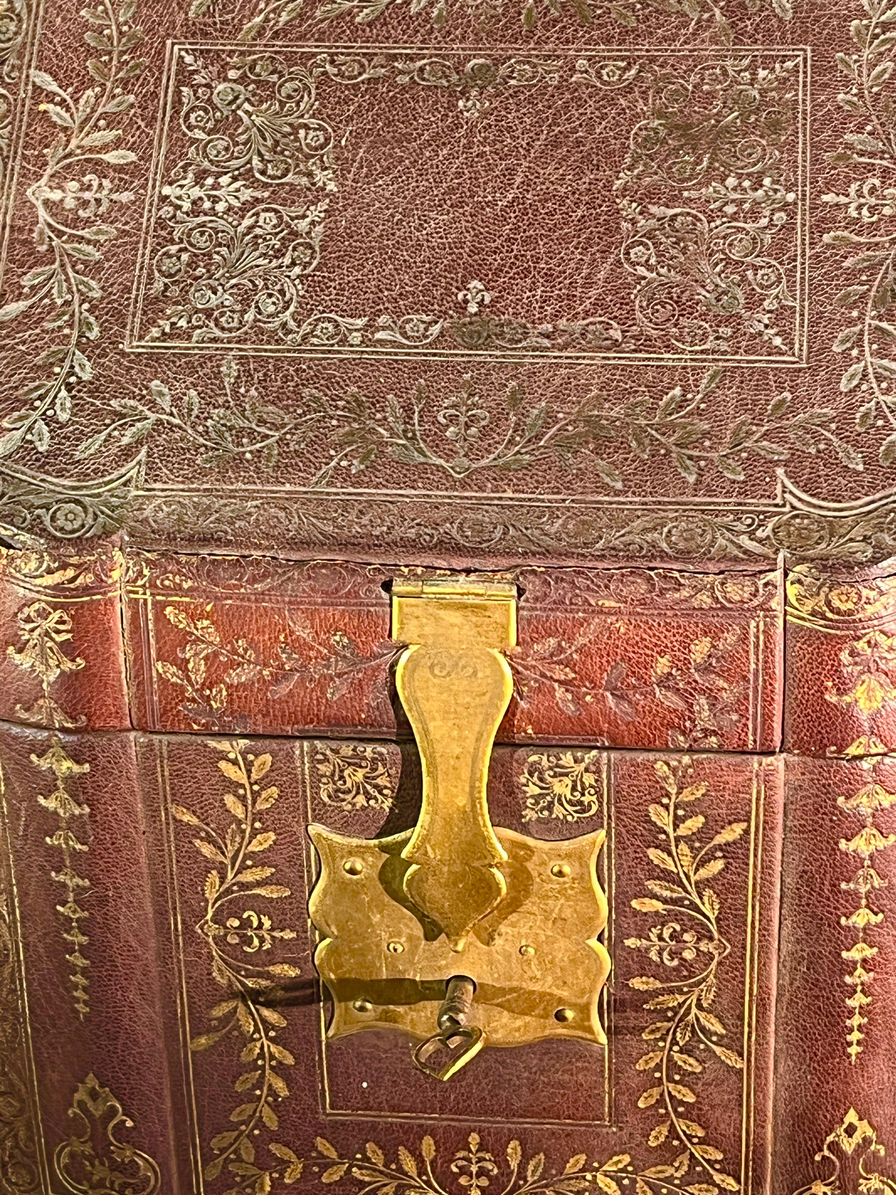 A fine Louis XV period document box in hand-tooled leather, with gilt brass hardware and retaining its original key. The divided interior is lined in green silk brocade. 