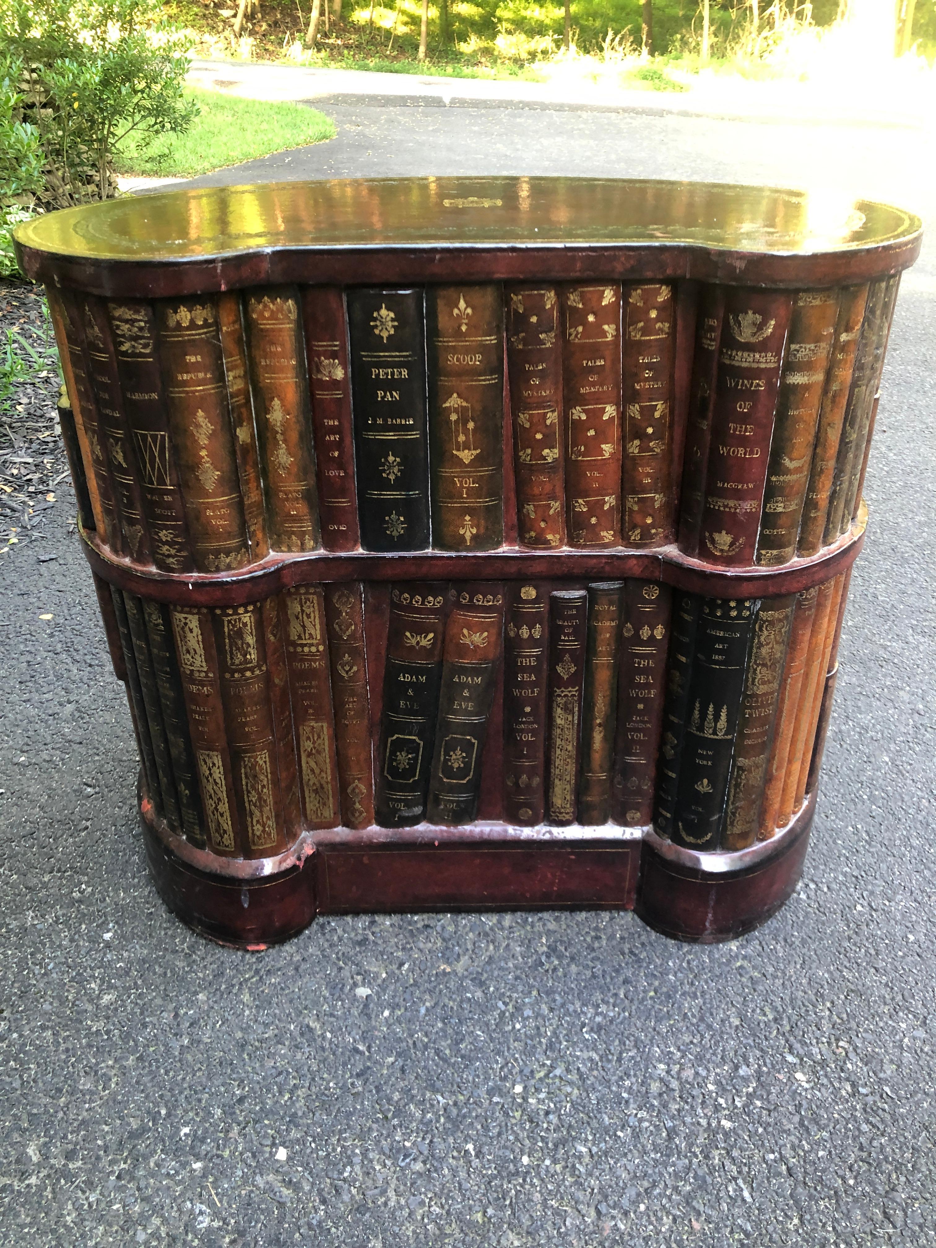 Tooled leather faux book kidney shaded side table by Maitland Smith drawers.