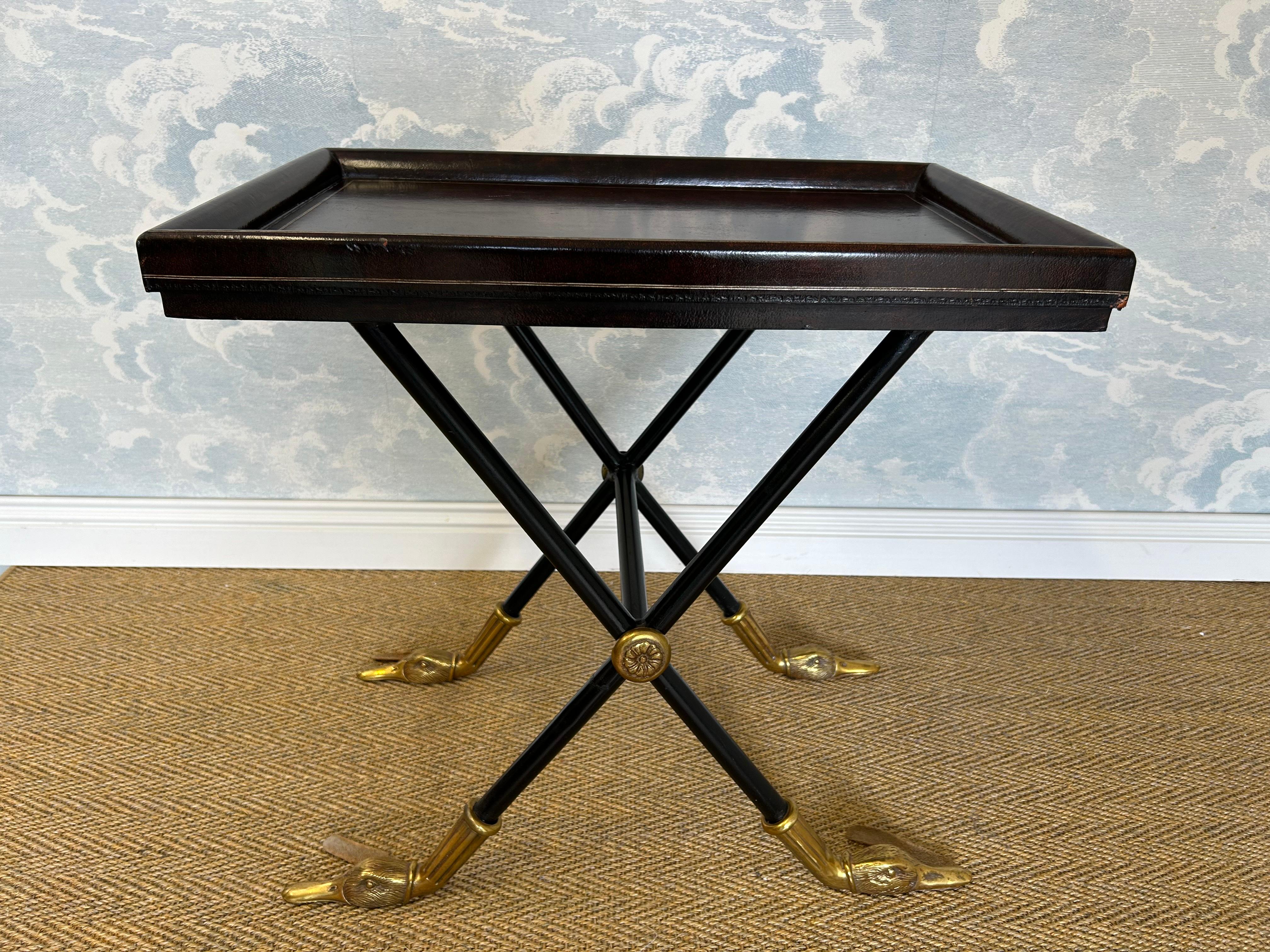 This beautifully hand crafted side table caught our attention thanks to its excellent proportions and to its brass feet in the shape of mallard heads.

Produced by the distinguished luxury furniture and decor manufacturer Maitland-Smith, this side