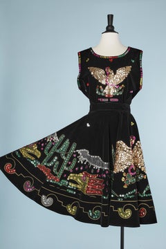 Top and skirt in black hand-painting velvet and multicolor sequins Circa 1970