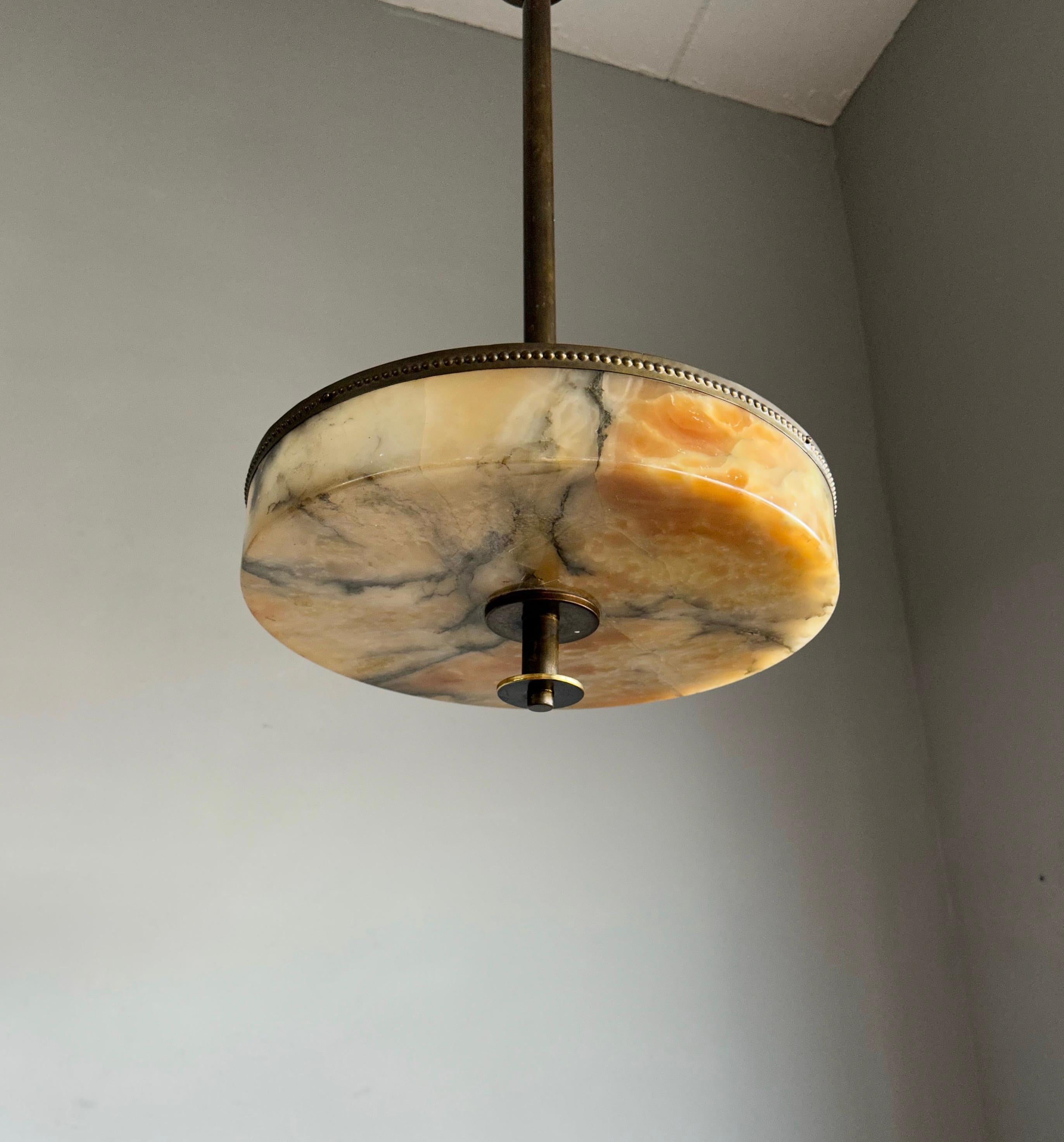 Stunning and perfect size, alabaster pendant of great quality AND condition.

This rare design and good size chandelier from the heydays of the European Art Deco era will never fail to impress you (or anyone visiting) and it is our most recent rare