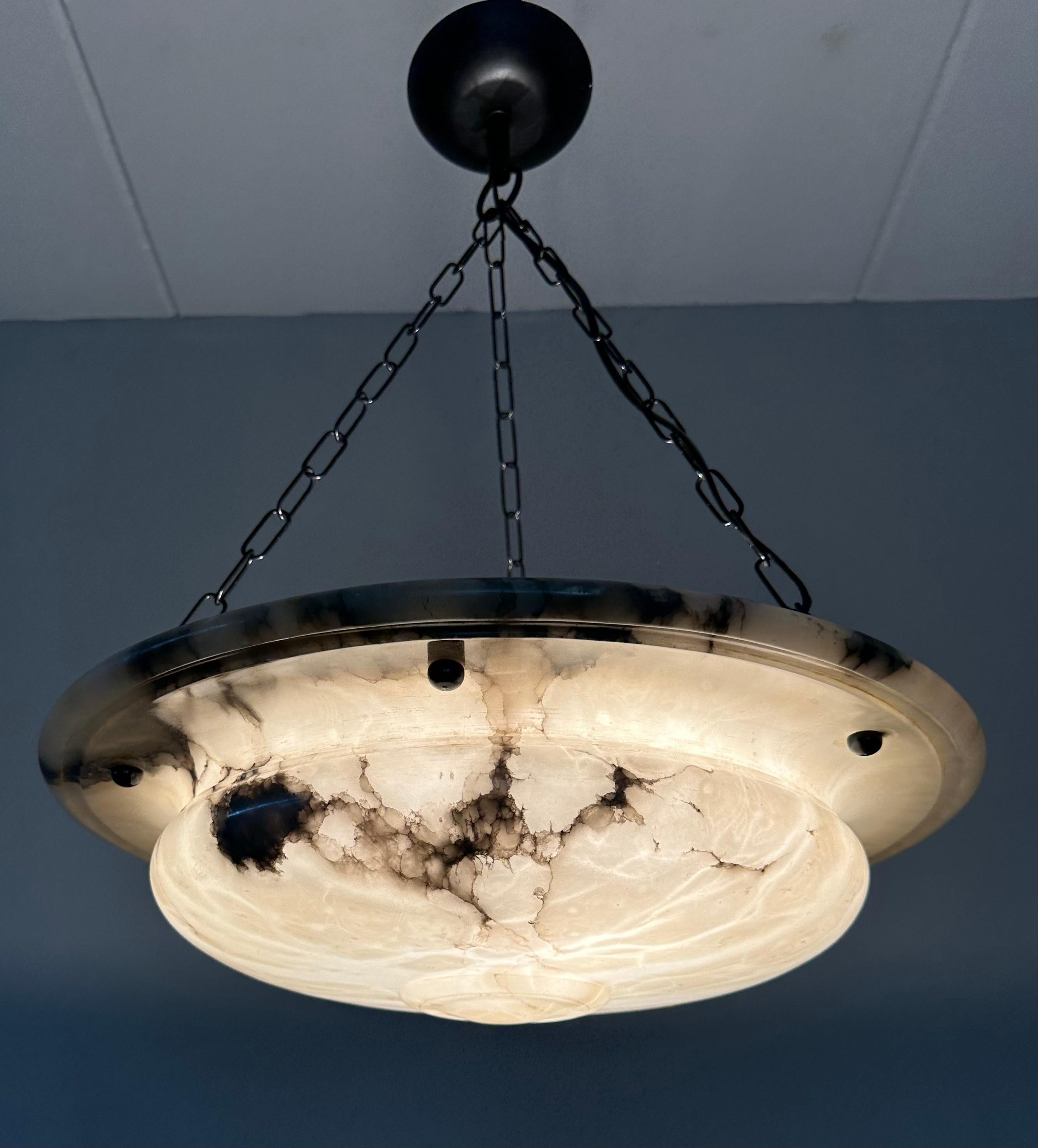 Stunning design and large size, 19,3 inches in diameter antique alabaster light fixture.

Thanks to its large size and elegant design this beautiful alabaster chandelier from the European Jugendstil era is bound to light up someone's days and