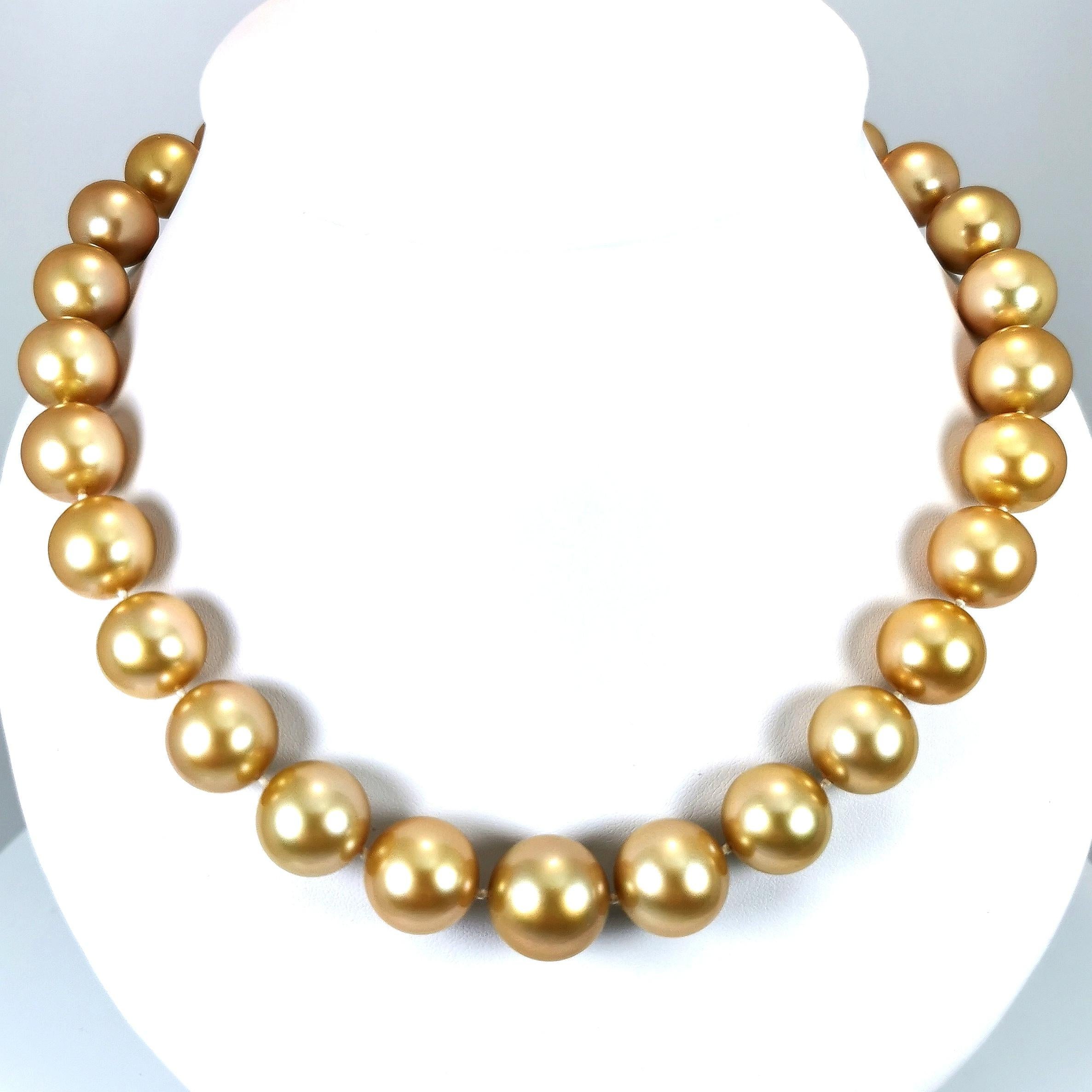 Exceptional and Rare necklace australian Southsea cultured pearls perfect round shape - Sizes Ø 14 x 16,1 MM natural deep Golden colour, clean surface. Mounted on silk thread with knots between each pearl and a magnificent Ø 15mm yellow gold 18K