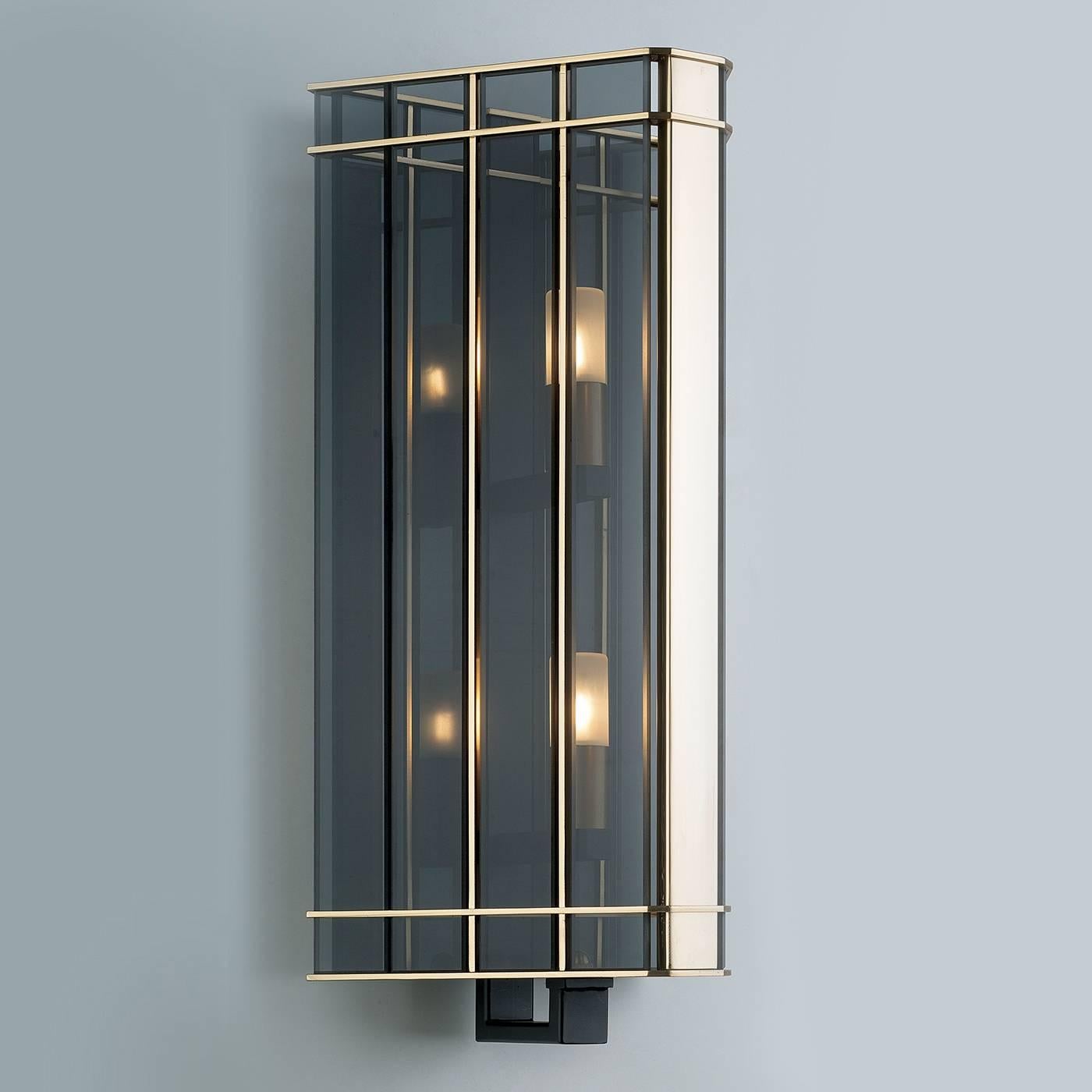 This striking sconce combines traditional crafting methods with a modern design inspired by the art deco's lavish style. The result is a timeless piece that will make a sophisticated statement in an entryway, a living room, even a bedroom. The