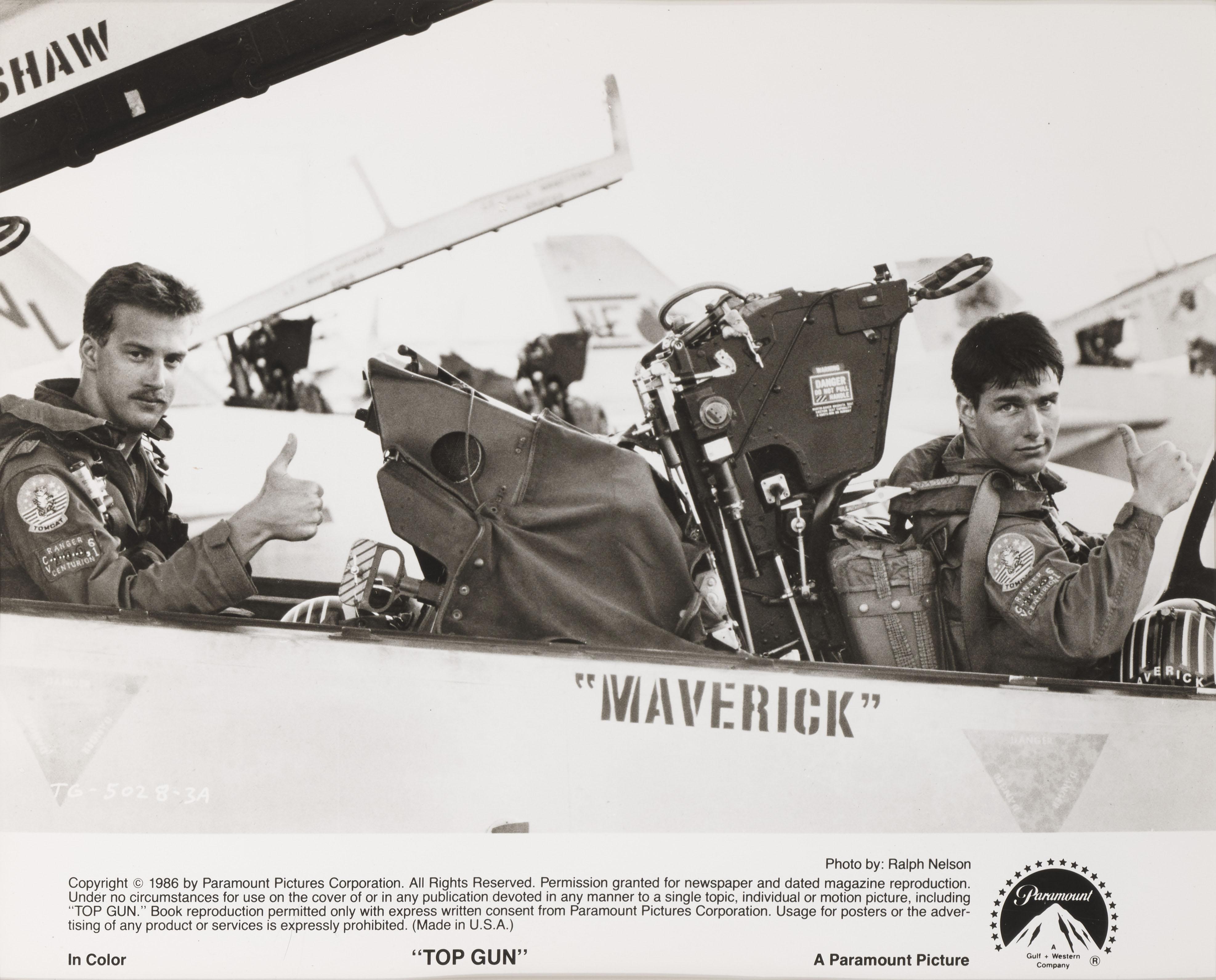 Original American photographic production still for the 1986 Blockbuster Top Gun starring Tom Cruise, Kelly McGillis, Tim Robbins, Val Kilmer and Michael Ironside.
This film was directed by Tony Scott.
This piece is conservation framed with UV