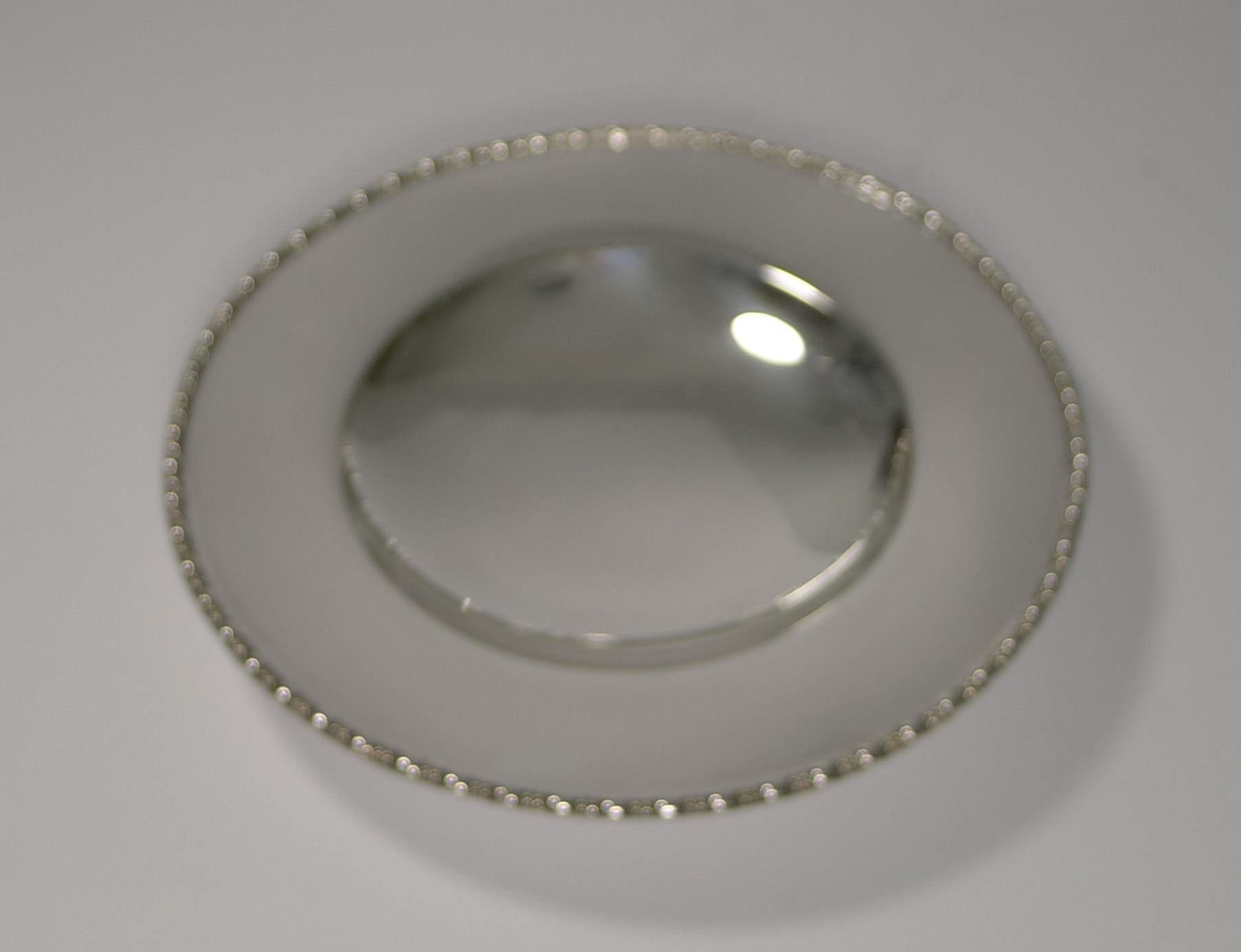 About as good as they come; this is an excellent example, lovely quality by the well renowned silversmith, Mappin and Webb, each plate signed on the underside.

The frame has an integral handle to the top clad in braided cane, an unusual and very