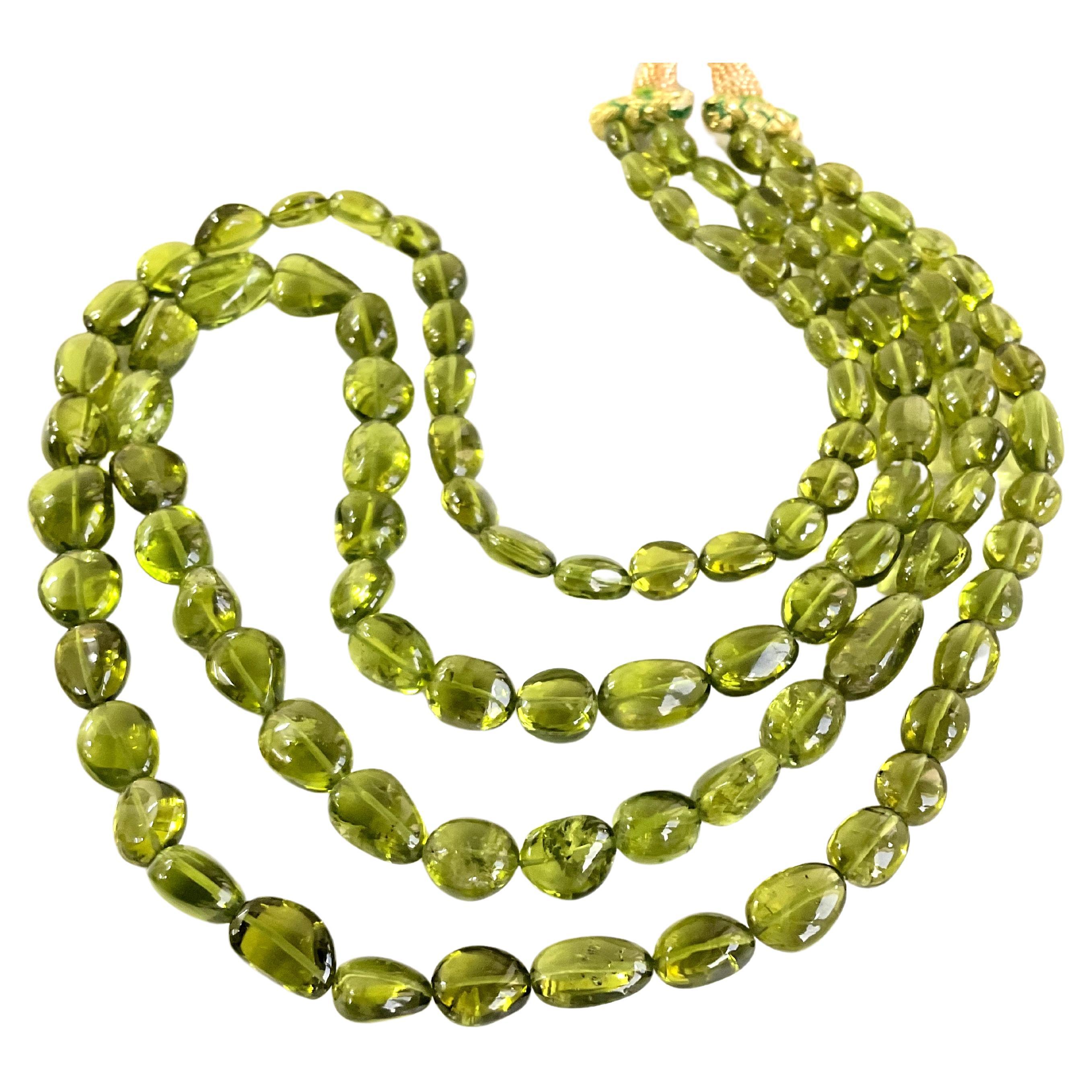 Top Quality Peridot Plain Tumbled Natural Gemstone Necklace 
Size : 6x7 To 13x10 Beads
Weight : 387.70 Carats
Strand - 2 Line