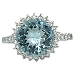 Top Quality Aquamarine Halo Ring in 14KW Gold