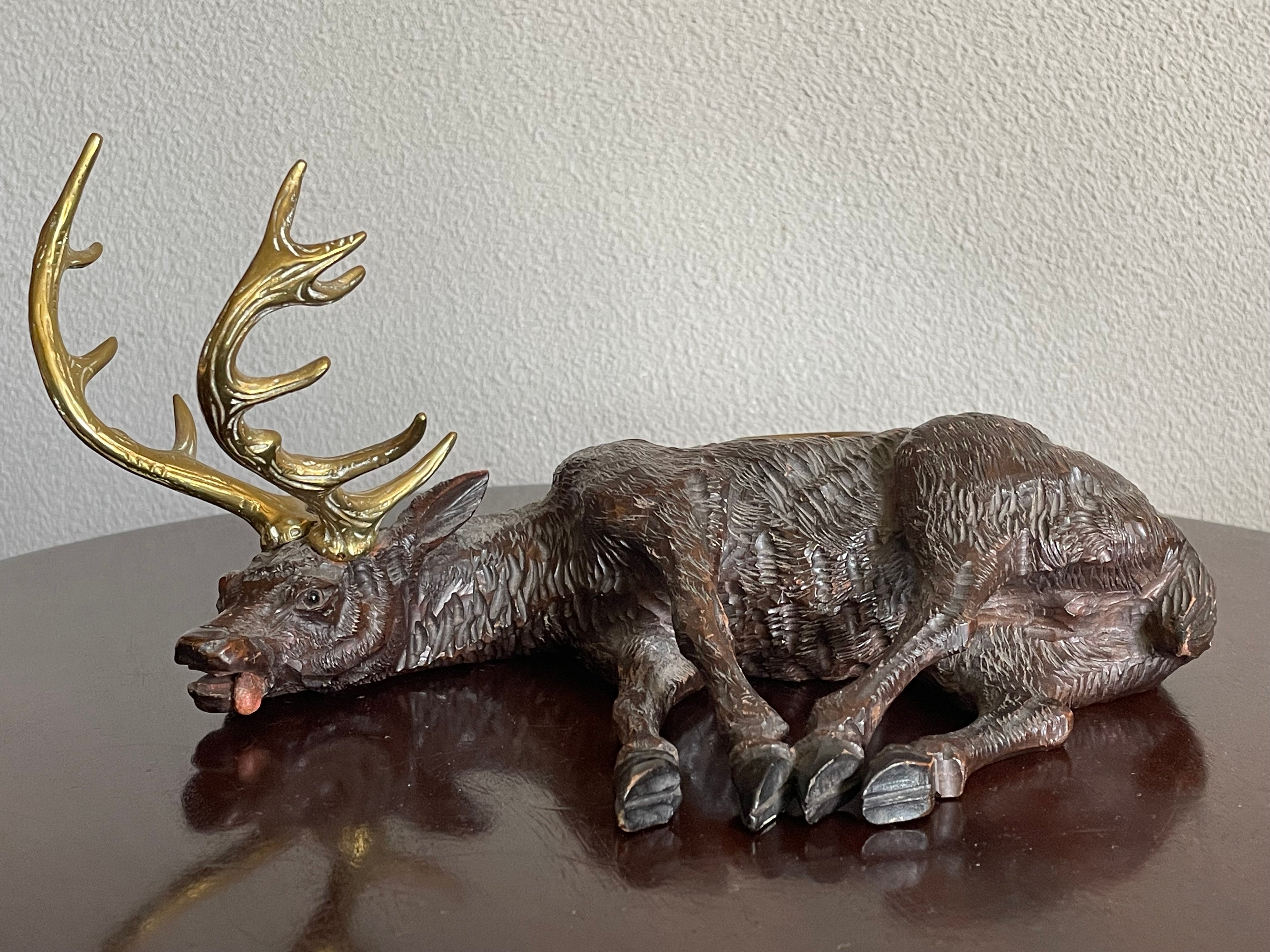Finest quality carved and very good condition Swiss black forest stag / deer sculpture.

For the collectors of the rarest and best quality Black Forest sculptures we also have this very detailed, hand-carved stag. Looking at the intricate details