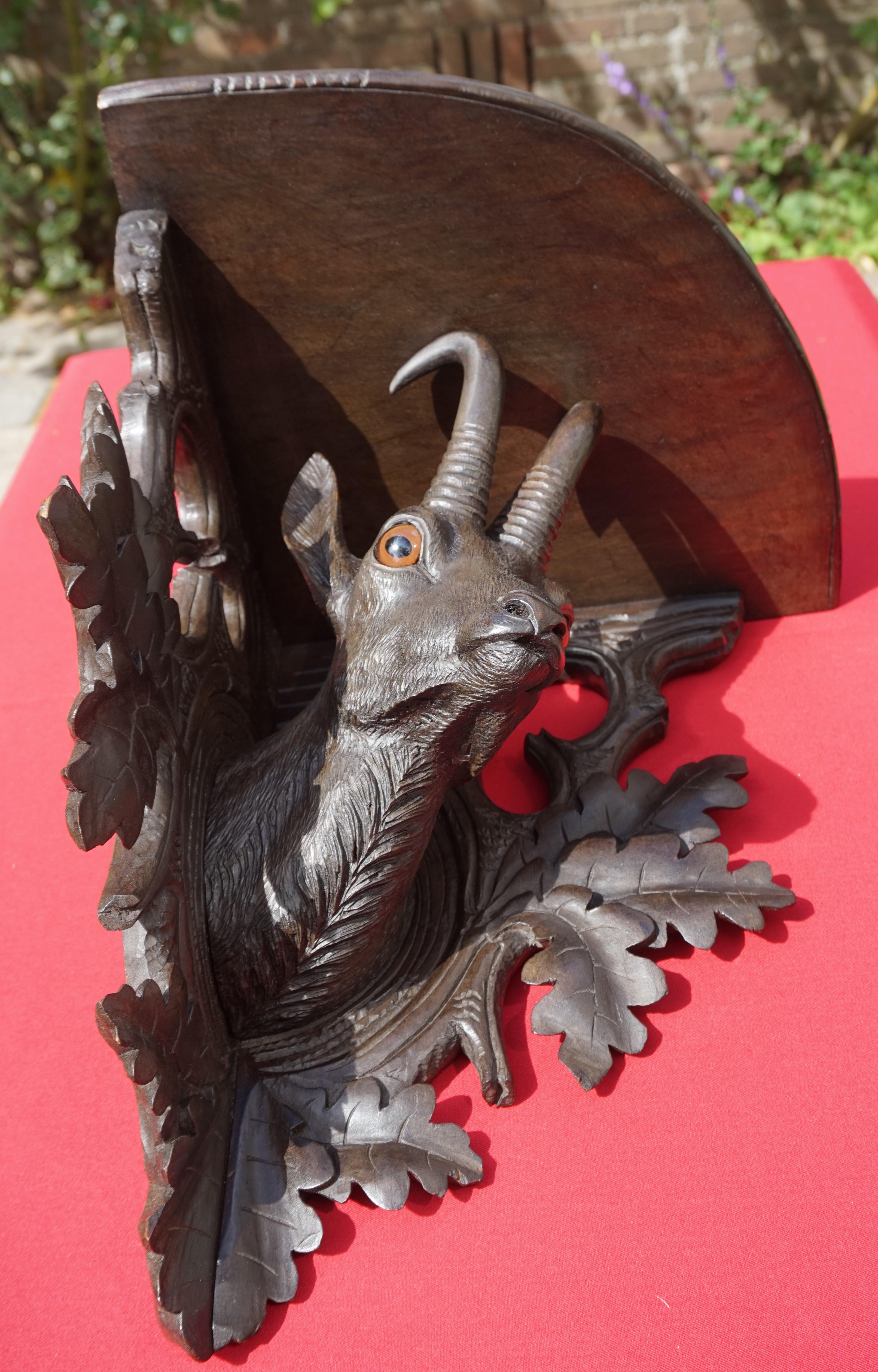 All hand carved and amazing condition Black Forest corner shelf.

Looking at the marvelous details of this striking Black Forest ibex, this corner bracket can only be the work of a master carver. The perfect shape of its head and the details of his