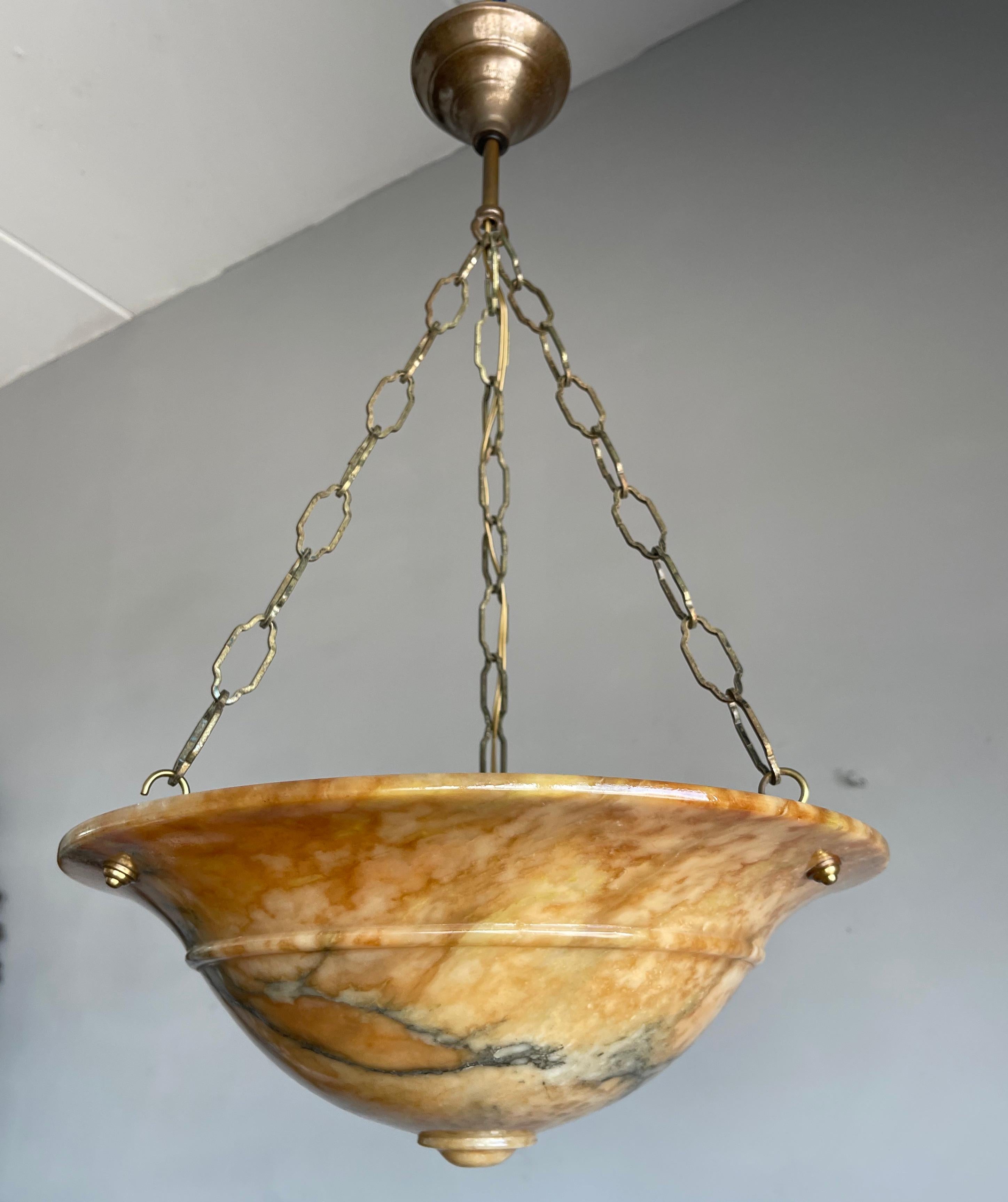 Beautiful colors with flowing black veins alabaster light fixture. 

If you are looking for a good quality and striking pendant to grace your interior then this early 20th century specimen could be perfect for you. It is all handcrafted, practical