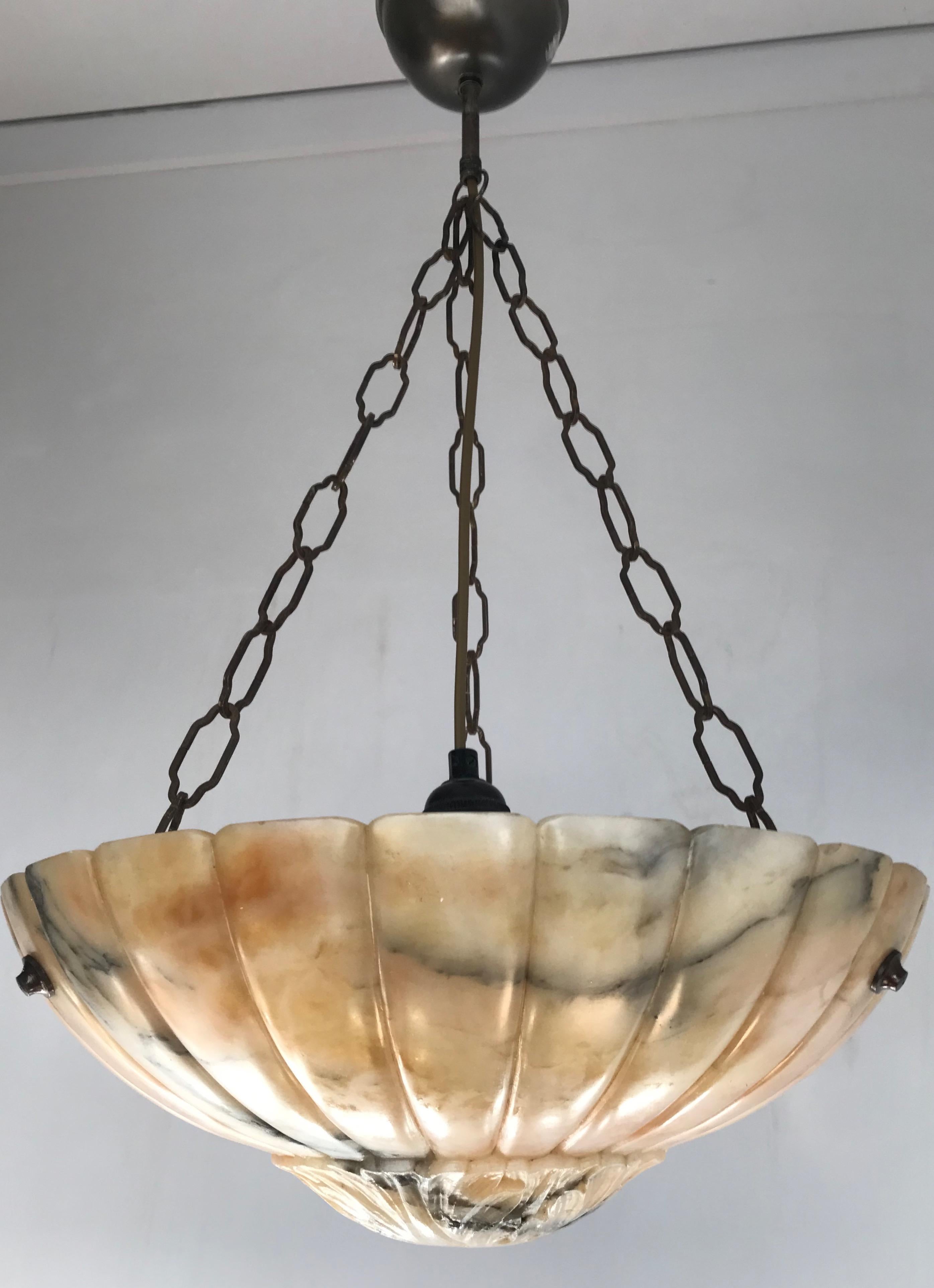 Beautiful colors with flowing black veins alabaster light fixture. 

If you are looking for a good quality and striking pendant to grace your interior then this early 20th century specimen could be perfect for you. It is all handcrafted, practical
