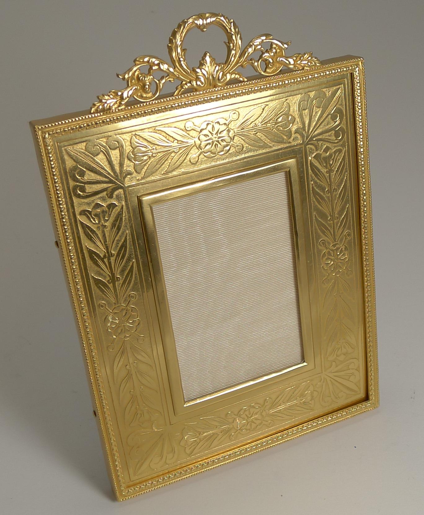 A truly fine French bronze photograph frame, beautifully gilded with the most stunning engraved slip surrounding the aperture, always highly prized.

The backing has been professionally refreshed to create a backing ready to last a further 100