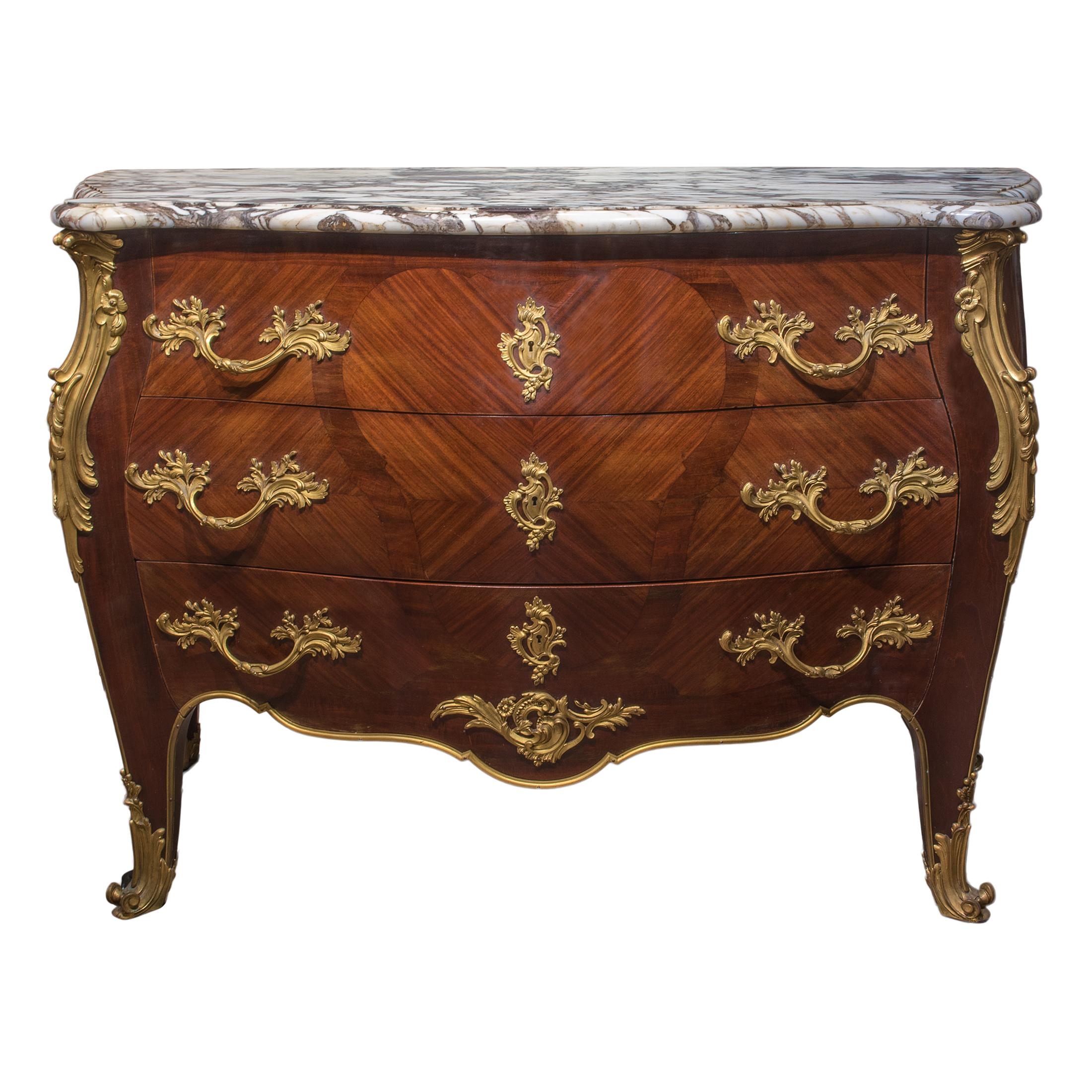 Louis XV-style gilt bronze mounted highly important commode surmounted by a breche violate marble top fitted with three long drawers. The back with a stenciled stamp ‘IDRAC/AMEUBLEMENTS DE LUXE/28, BOULEVARD HAUSSMANN - PARIS.’

Origin: