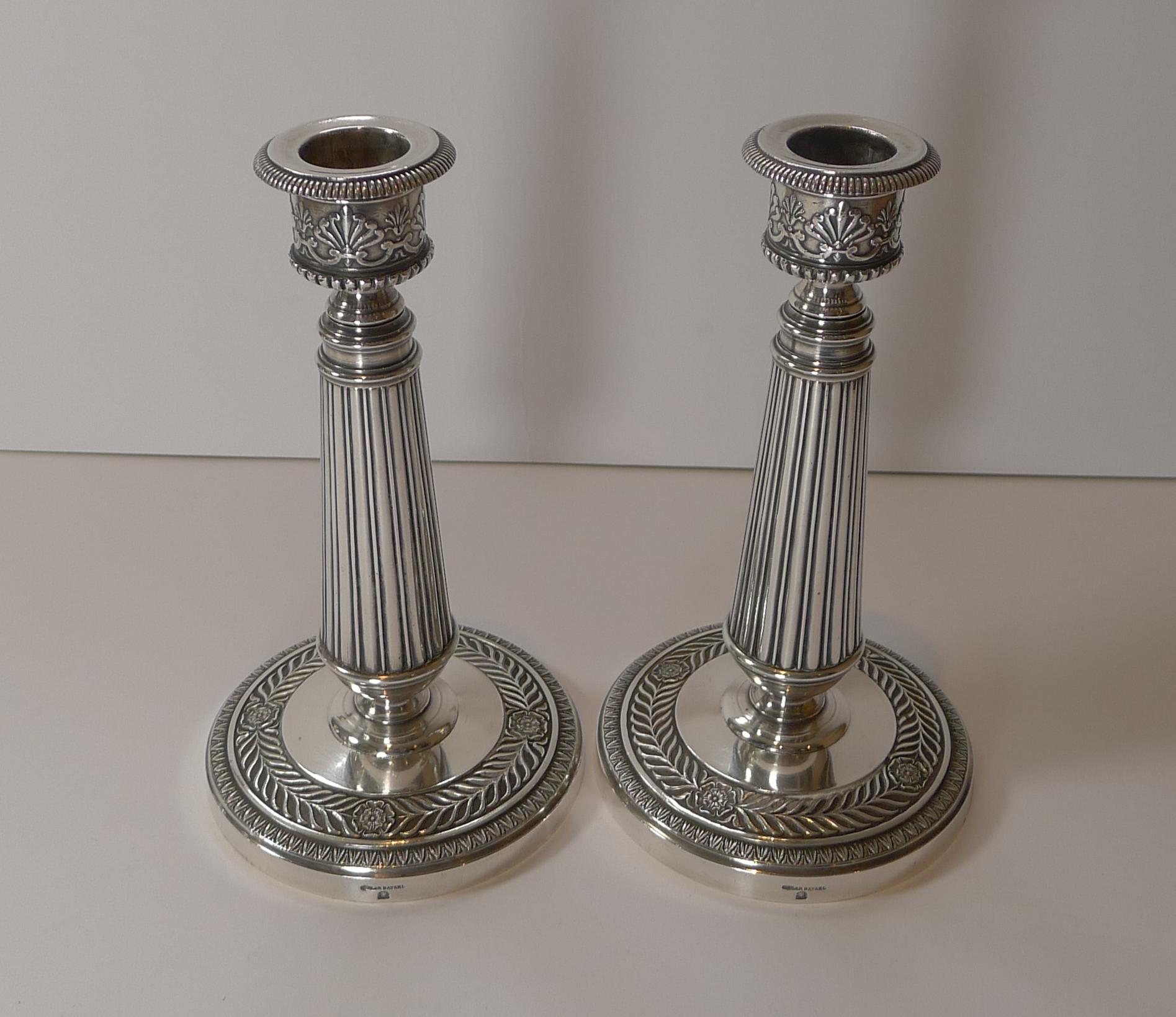 A very fine pair of small silver plated candlesticks, the perfect size for a desk or mantlepiece. Made around 1890/1900 in Paris by the top-notch silversmith, Cailar Bayard. 

Cailar & Bayard, 37 rue Grange-aux-Belles, Paris, founded in 1848 by