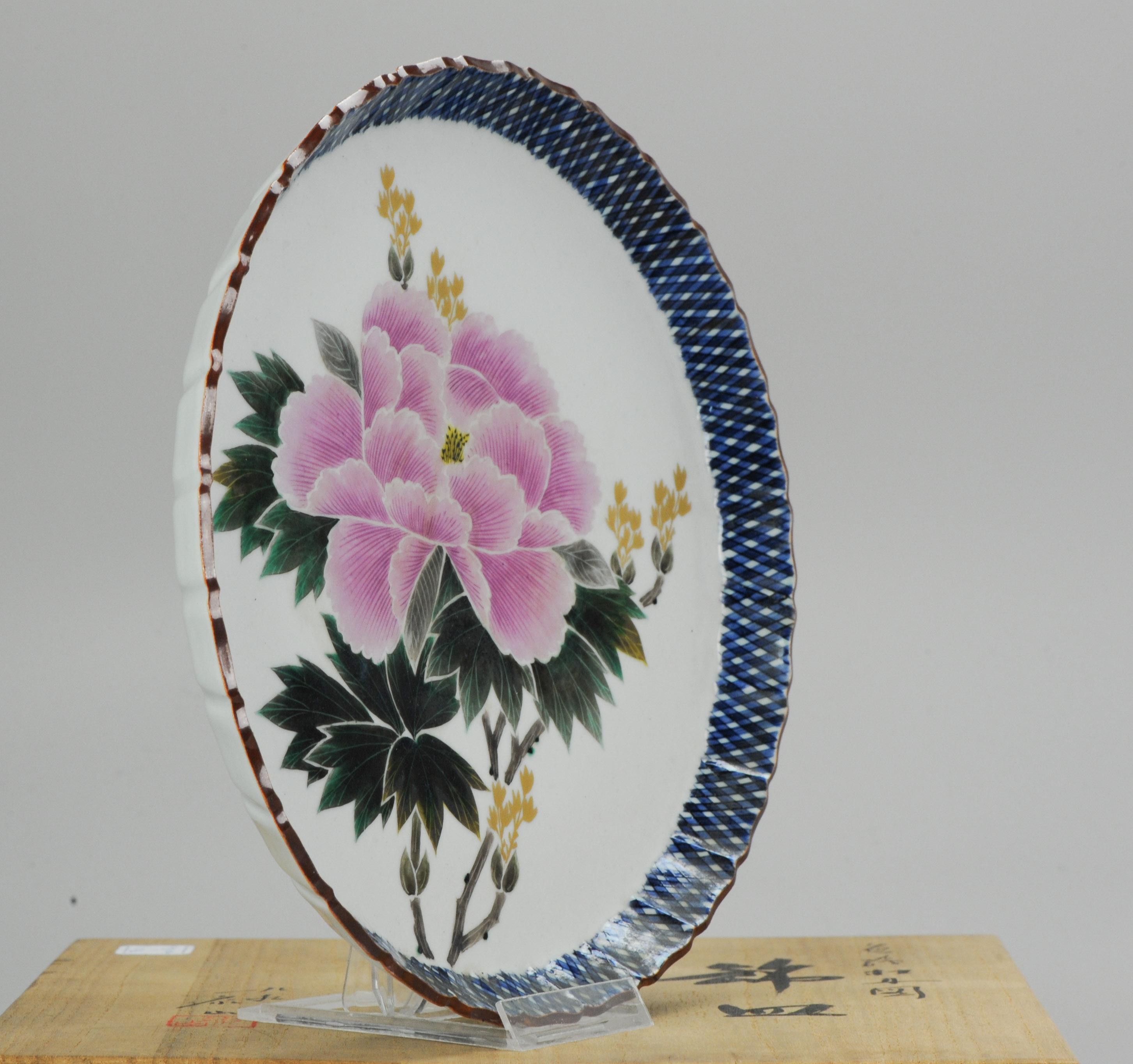 A very nicely decorated Japanese Kutani Plate, vintage.

Additional information:
Material: Porcelain & Pottery
Region of Origin: Japan
Period: 20th century
Condition: Perfect
Dimension: Ø 26 x 3.7 H cm