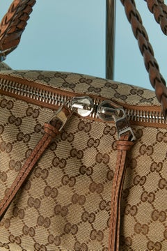 Top shoulder bag in canevas monogram pattern and leather top handle Gucci
