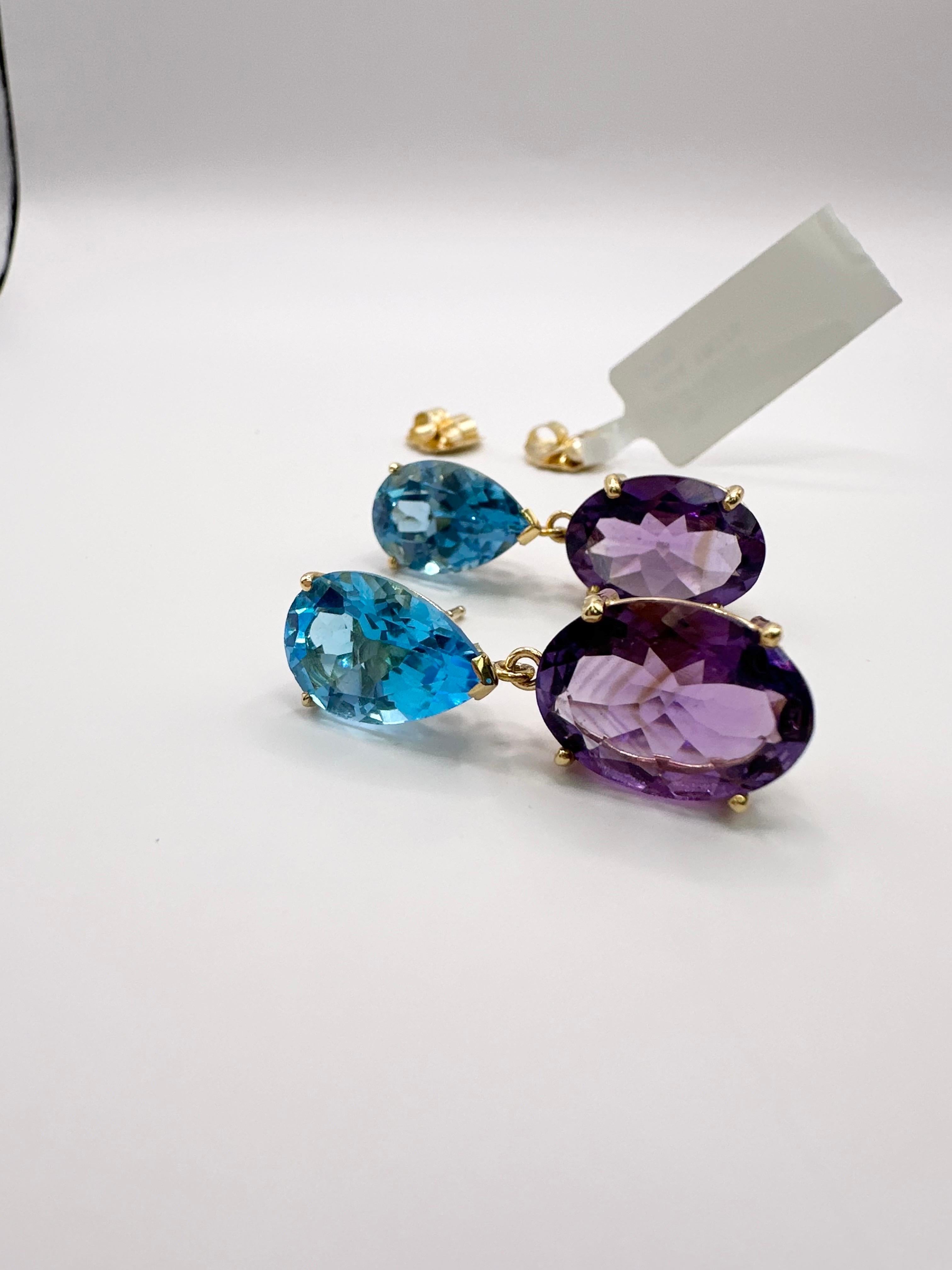 Gemstone stud earrings in 14KT yellow gold made with huge topaz and amethyst gems! Bright earrings for everyday!

Certificate of authenticity comes with purchase!

ABOUT US
We are a family-owned business. Our studio in located in the heart of Boca