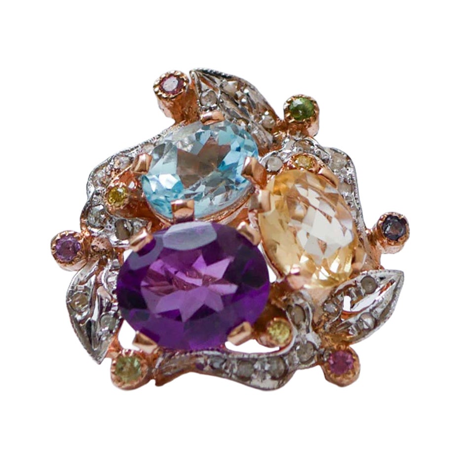 Topacio, amatistas, turmalina, diamantes, anillo de oro rosa y plata.