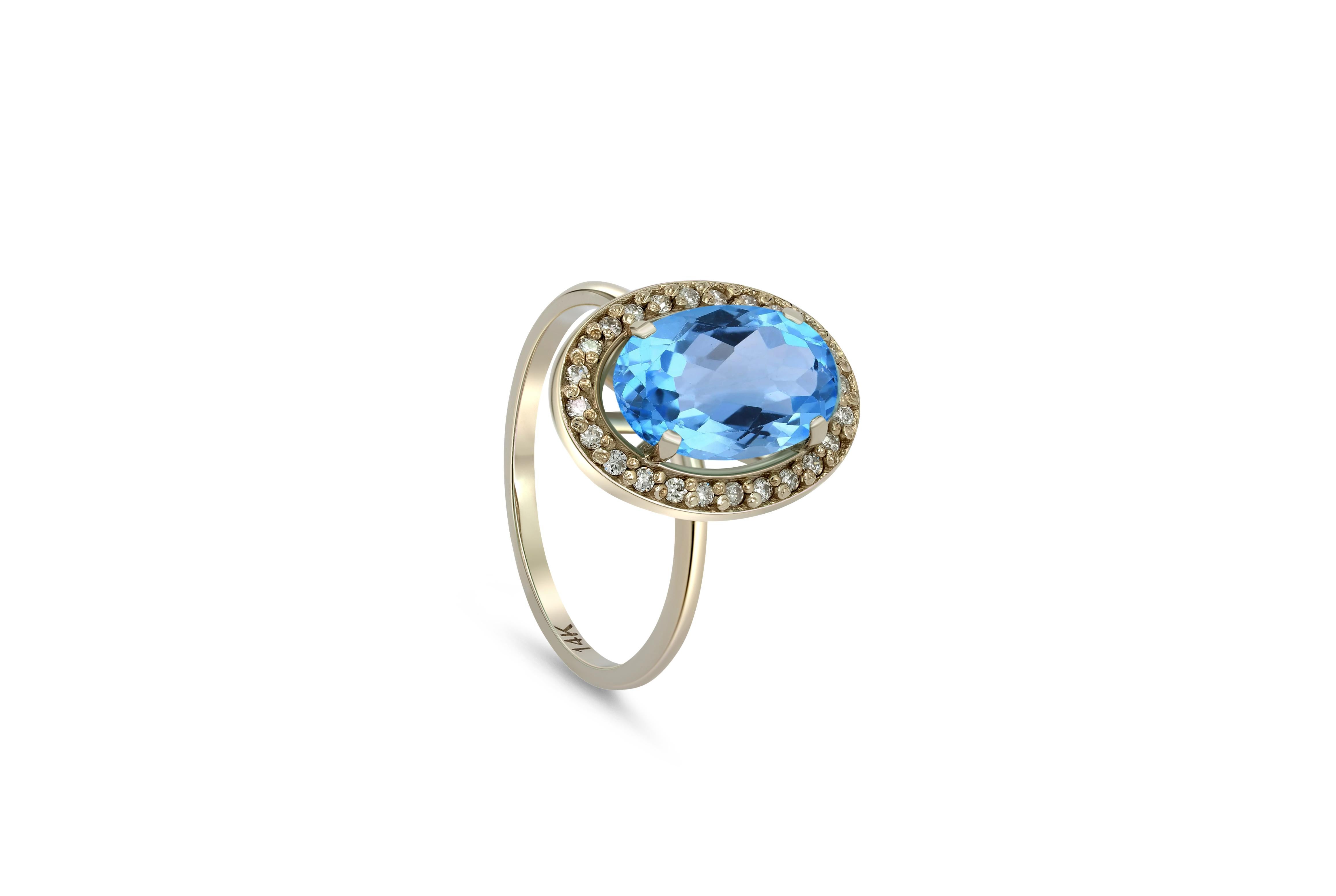 Topaz and diamonds 14k gold ring. 
Oval Topaz gold ring. Topaz diamond halo ring. Blue gemstone ring.

Metal: 14k gold
Weight: 3 gr depends from size

Gemstones:
Topaz - 1 piece
Cut - oval
Color - blue
Weight - 3-3.2 ct

Side gemstones -