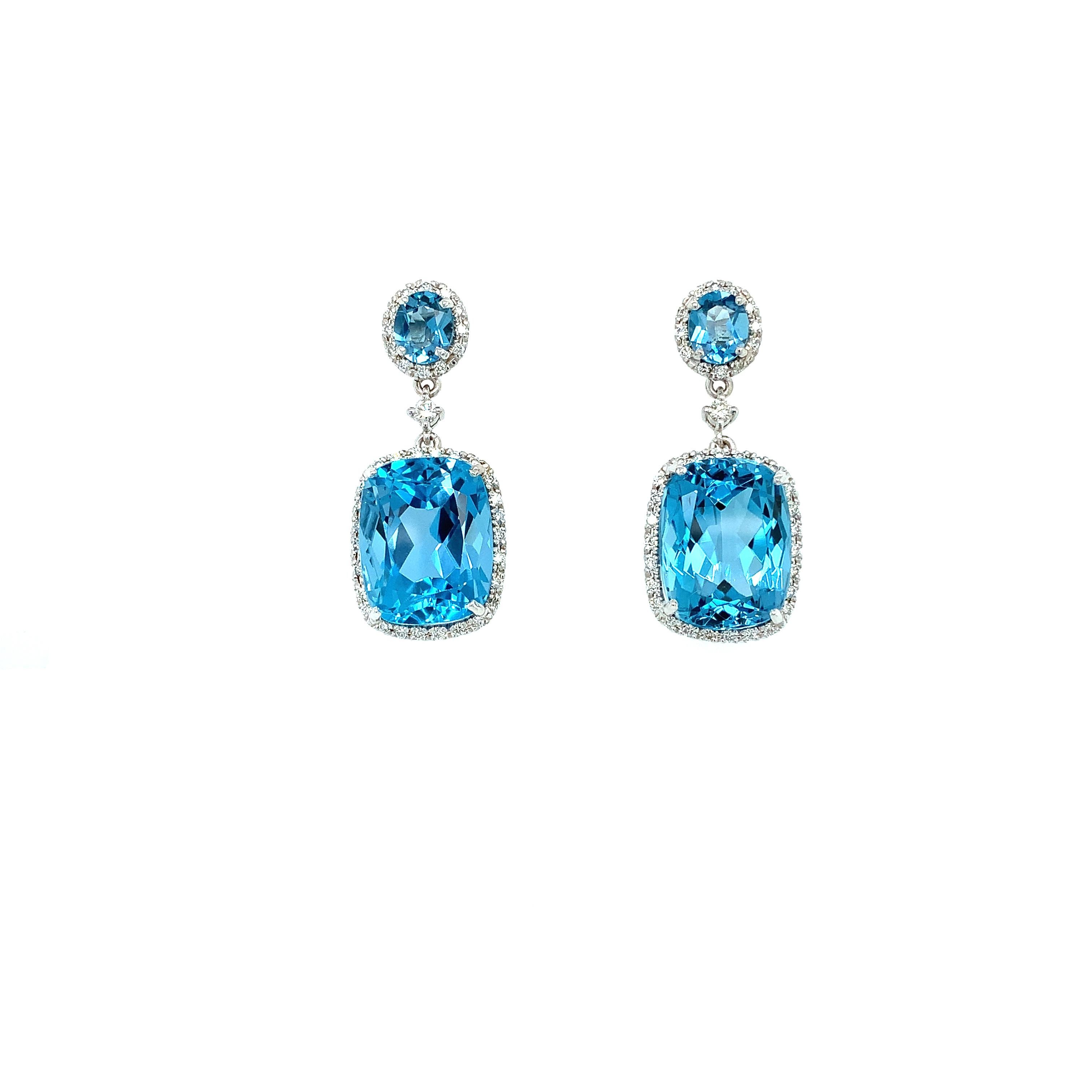 Gorgeous topaz and diamonds art deco drop earrings 18k white gold
Composed of blue vivid topaz gemstone surrounded by diamond halo all mounted in 18k white gold
Blue topaz cushion and round shaped natural gemstone total weight approximately