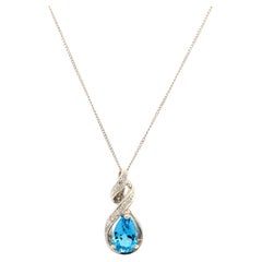 Collana con pendente a goccia art déco in oro bianco con topazio e diamanti