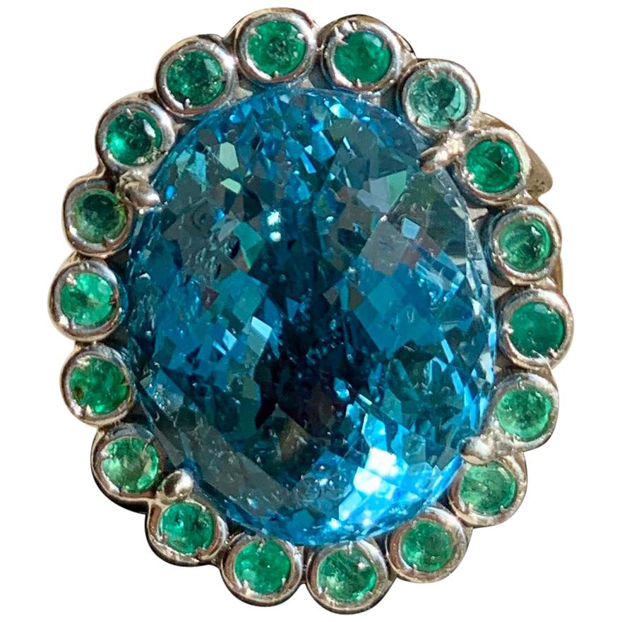 33.50 Carats Blue Topaz and Emerald Cocktail Ring For Sale