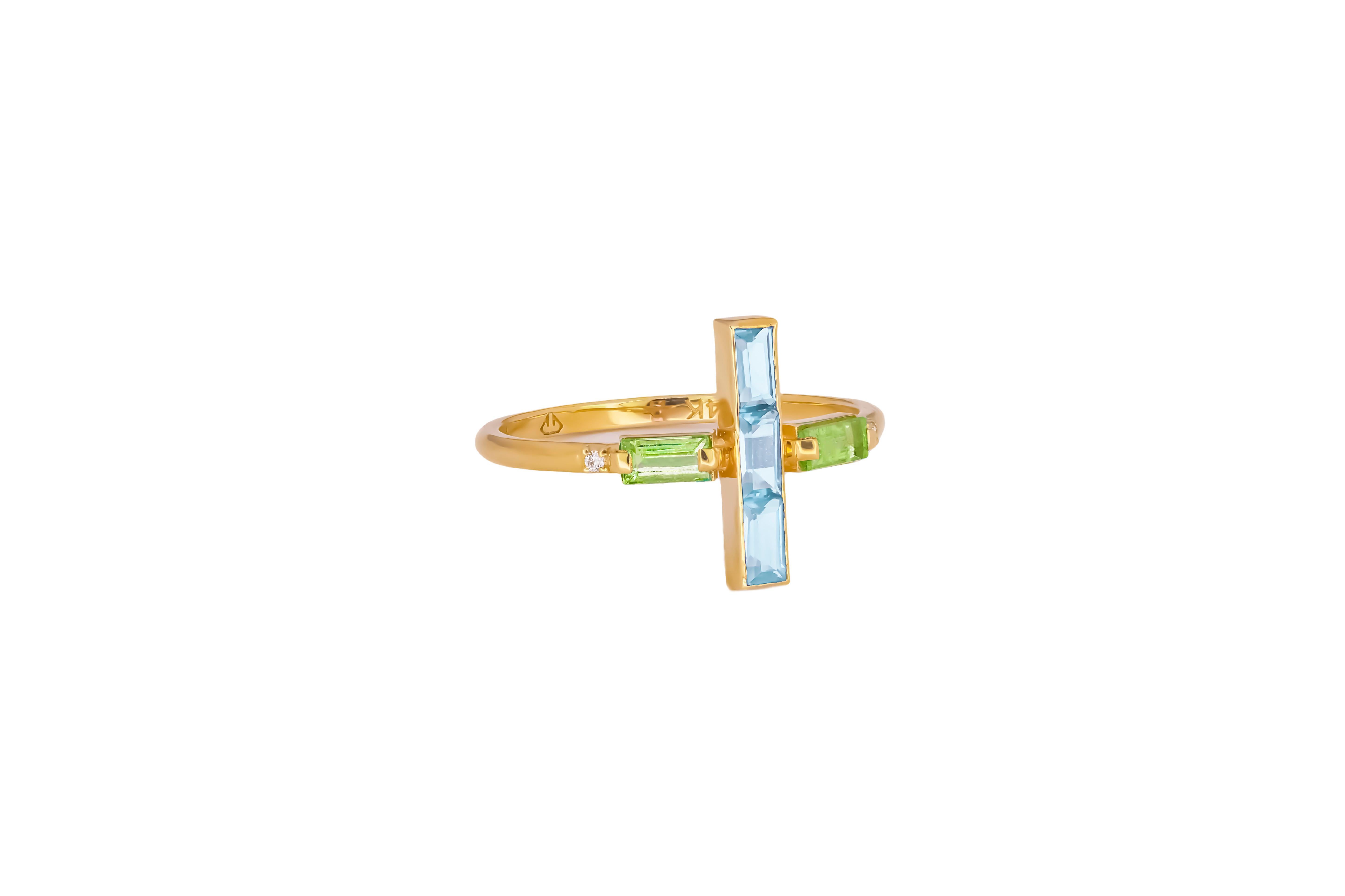 Topaz and peridot 14k gold ring.  
14K Solid Gold Cross Ring. Solid Gold Cross Ring with Gemstones. Topaz gold ring. Peridot gold ring. Baguette topaz ring. Blue gemstone ring. Green gemstone ring. Colorful gold ring. Genuine peridot ring. Peridot