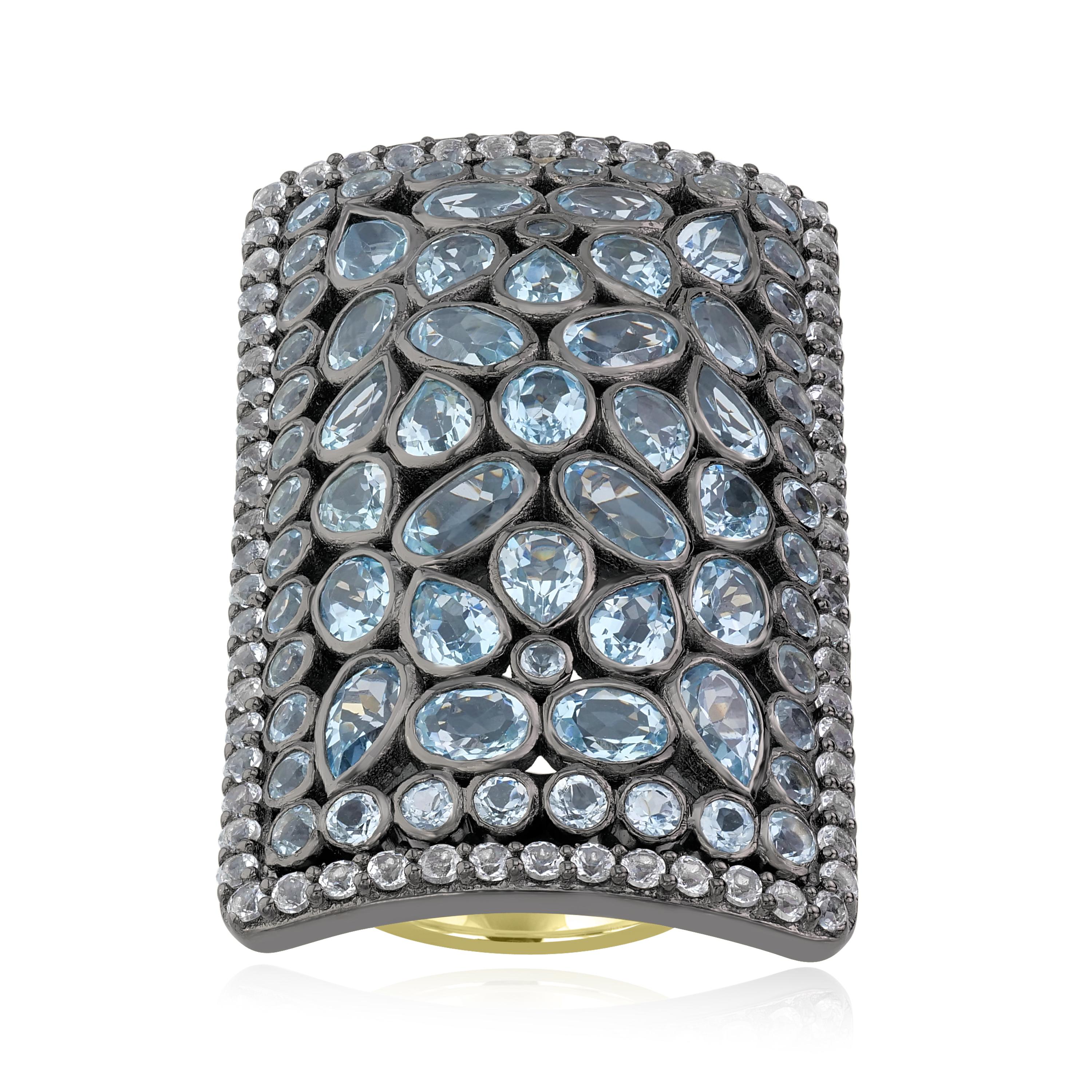 A statement ring just for your special nights. This women's ring showcases 69 sky blue topaz in varied shapes and sizes framed within 66 white natural zircon set in genuine and nickel free 925 sterling silver. This ring comes with a 14K gold