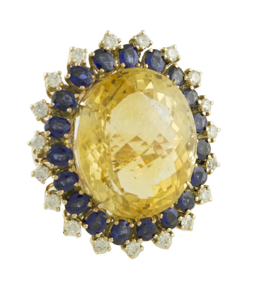 Amazing 14K rose gold ring mounted with unique topaz in the center surrounded by blue sapphires crown and white diamonds detailes
Diamonds 0.97 ct 
Blue Sapphires 4.01 ct 
Topaz 40.10 ct      2.3 cm X 2 cm 
Total Weight 19.3 g 
R.F + oieu
Dimentions