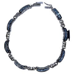 Topasblaues Tennisarmband aus 10K Weißgold.