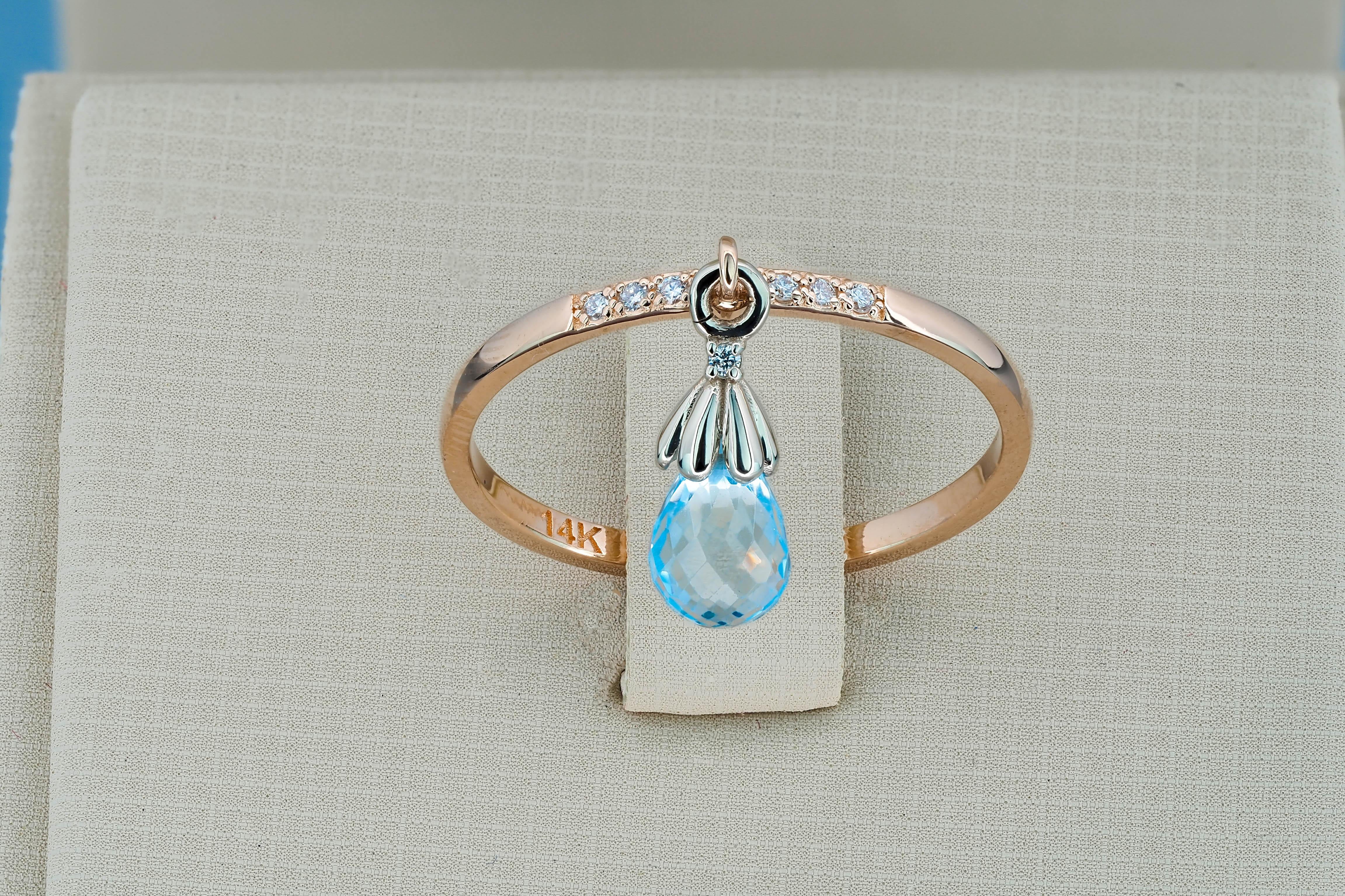 Topaz briolette 14k gold ring. 
Topaz tear drop ring. Sky blue topaz ring. Tiny topaz ring. Casual ring with topaz. November birthstone ring.

Metal: 14k gold
Weight: 1.6 g. depends from size.

Central stone: topaz
Cut: briolette
Color: