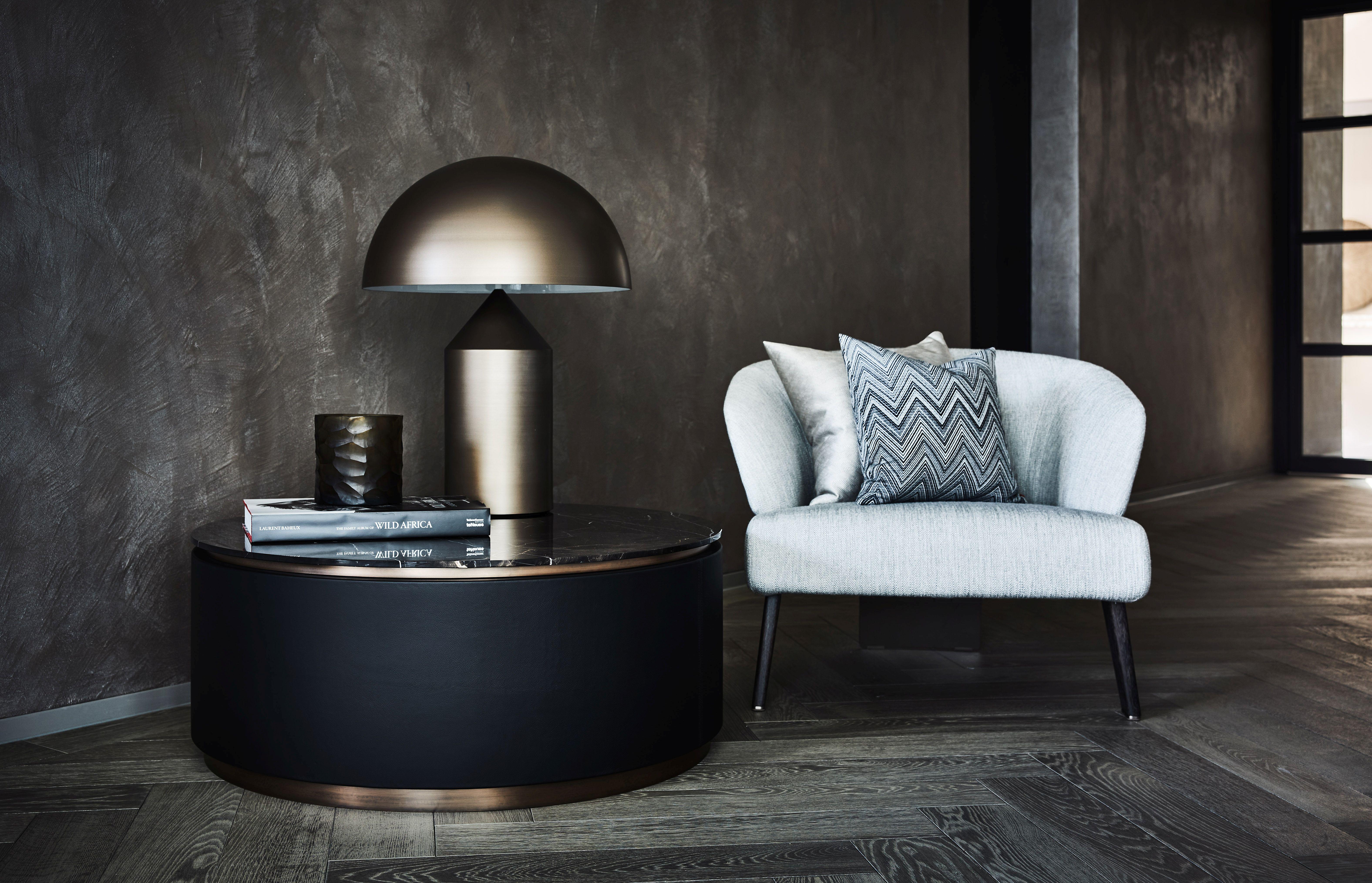 Topaz: This handmade table combines soft leather with beautiful metal lacquered plinths and Italian café amaro marble top.

The Topaz coffee table is no shrinking violet. Its distinctive design is complemented by the close attention paid to detail