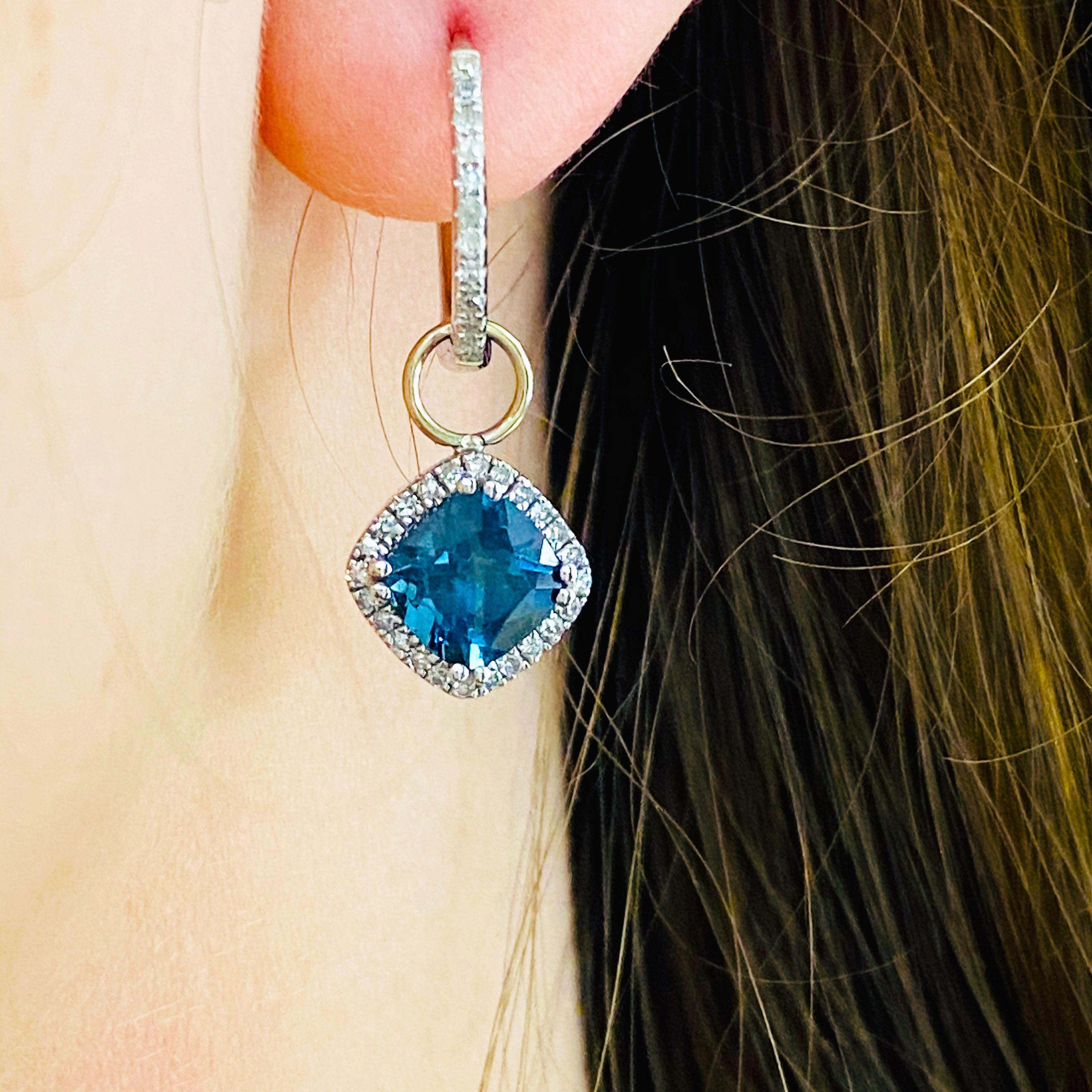 These stunning earring charms are the perfect way to dress up any pair of hoops! With polished 14k white gold surrounding brilliant blue sapphires and dripping with white diamonds, these charms make the perfect chic and modern accessory for any