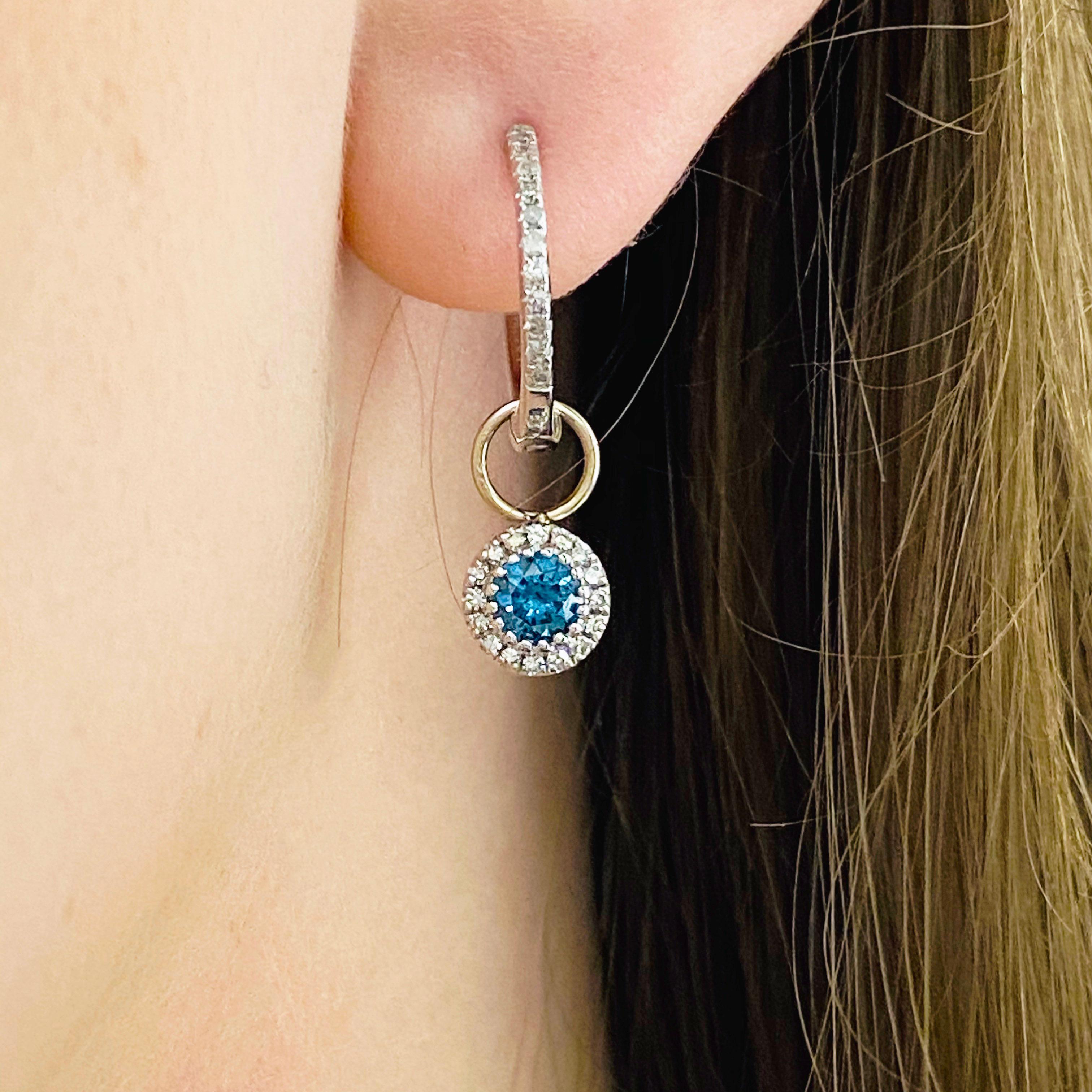 These stunning earring charms are the perfect way to dress up any pair of hoops! With polished 14k white gold surrounding a brilliant round blue topaz and dripping with white diamonds, these charms make the perfect chic and modern accessory for any