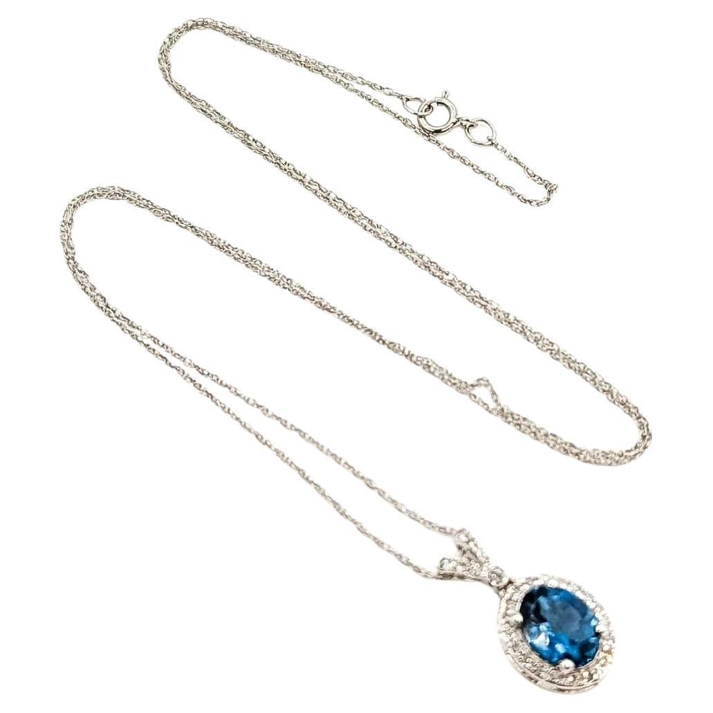 Topaz & Diamond Halo Pendant in 10k White Gold