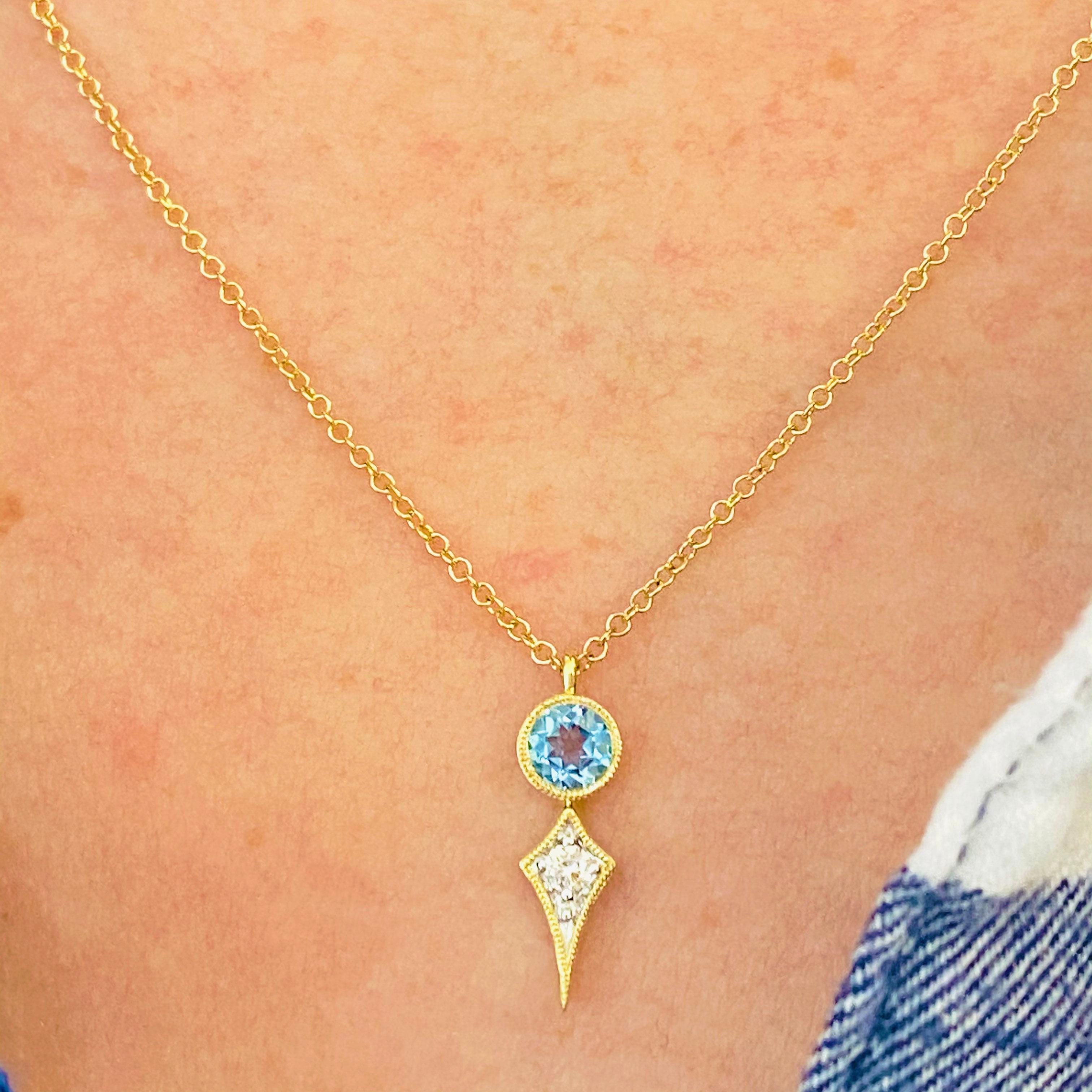 This stunningly beautiful genuine Swiss blue topaz set in polished 14k yellow gold next to a brilliant white diamond provides a look that is very modern yet classic! This necklace is very fashionable and can add a touch of style to any outfit, yet