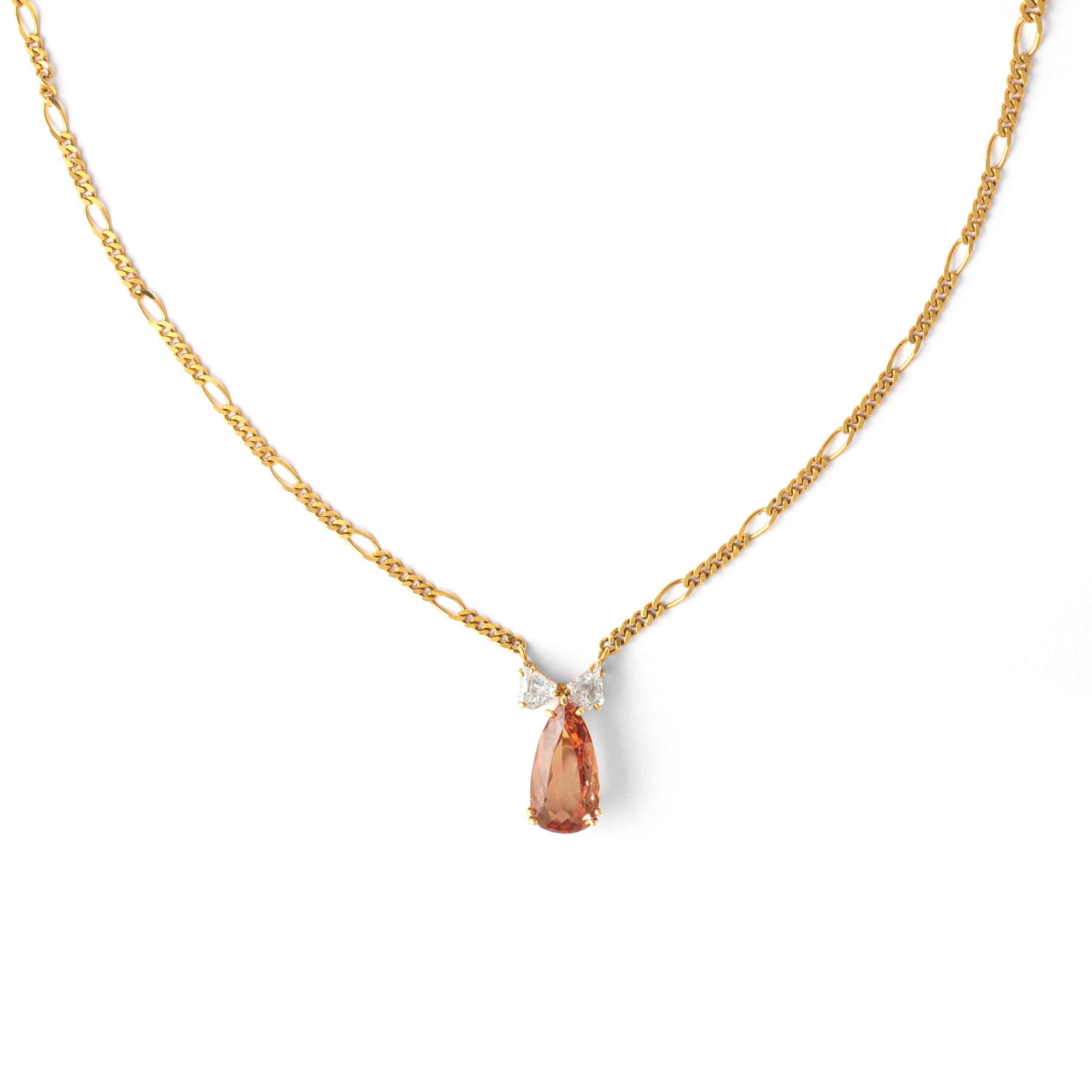 Indulge in the exquisite allure of our Topaz Diamond Pendant Chain Necklace - a radiant statement piece that captures attention with its timeless elegance.

Suspended from a delicate chain, the centerpiece features a resplendent topaz weighing 3.62