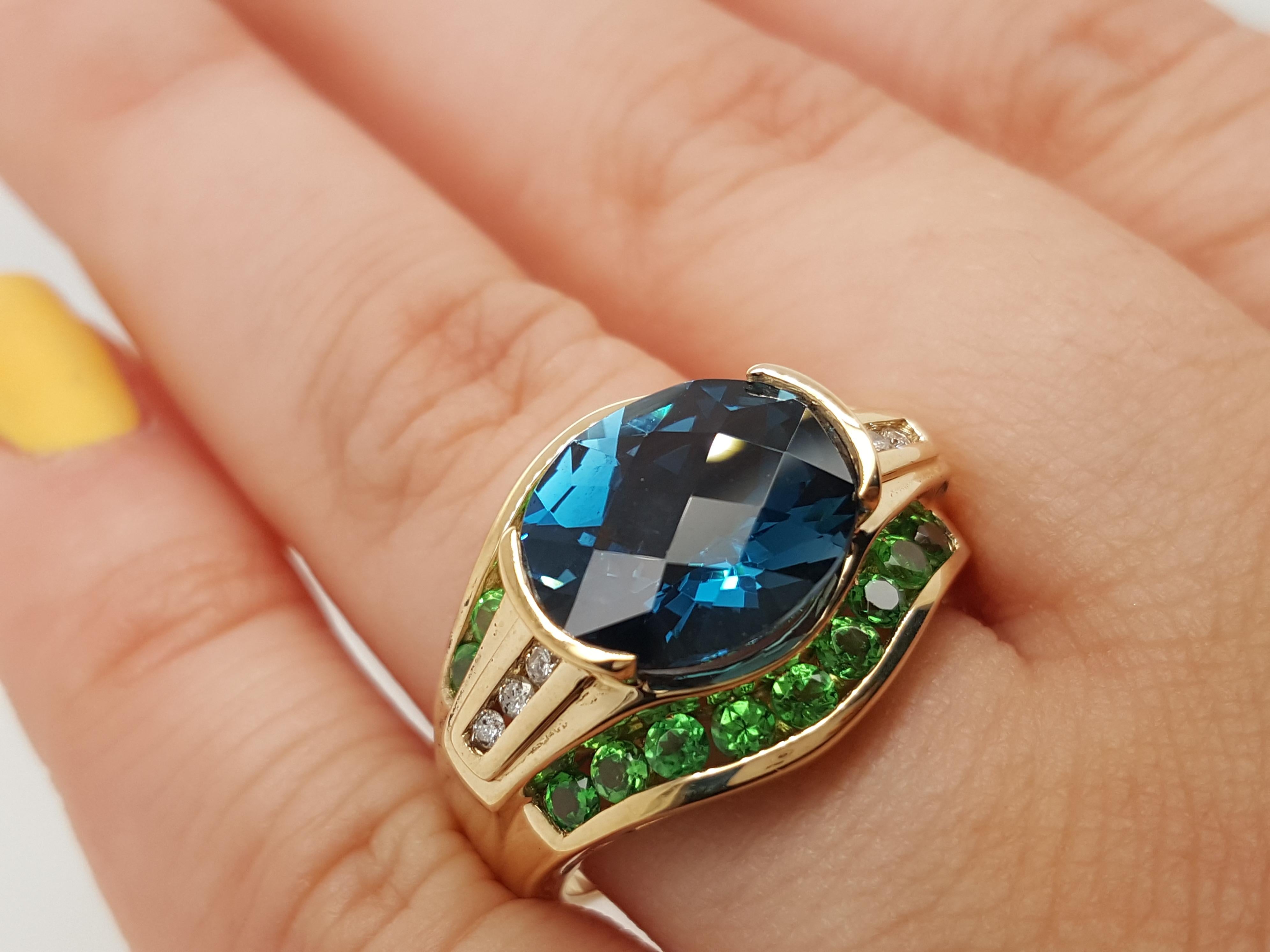 Absolutely gorgeous, this retro style ring is the perfect statement accessory. The ring is fashioned in classic 14 karat yellow gold and features a blue royal-purple oval shape center Topaz.  Size 8 can be sized up or down upon request prior to