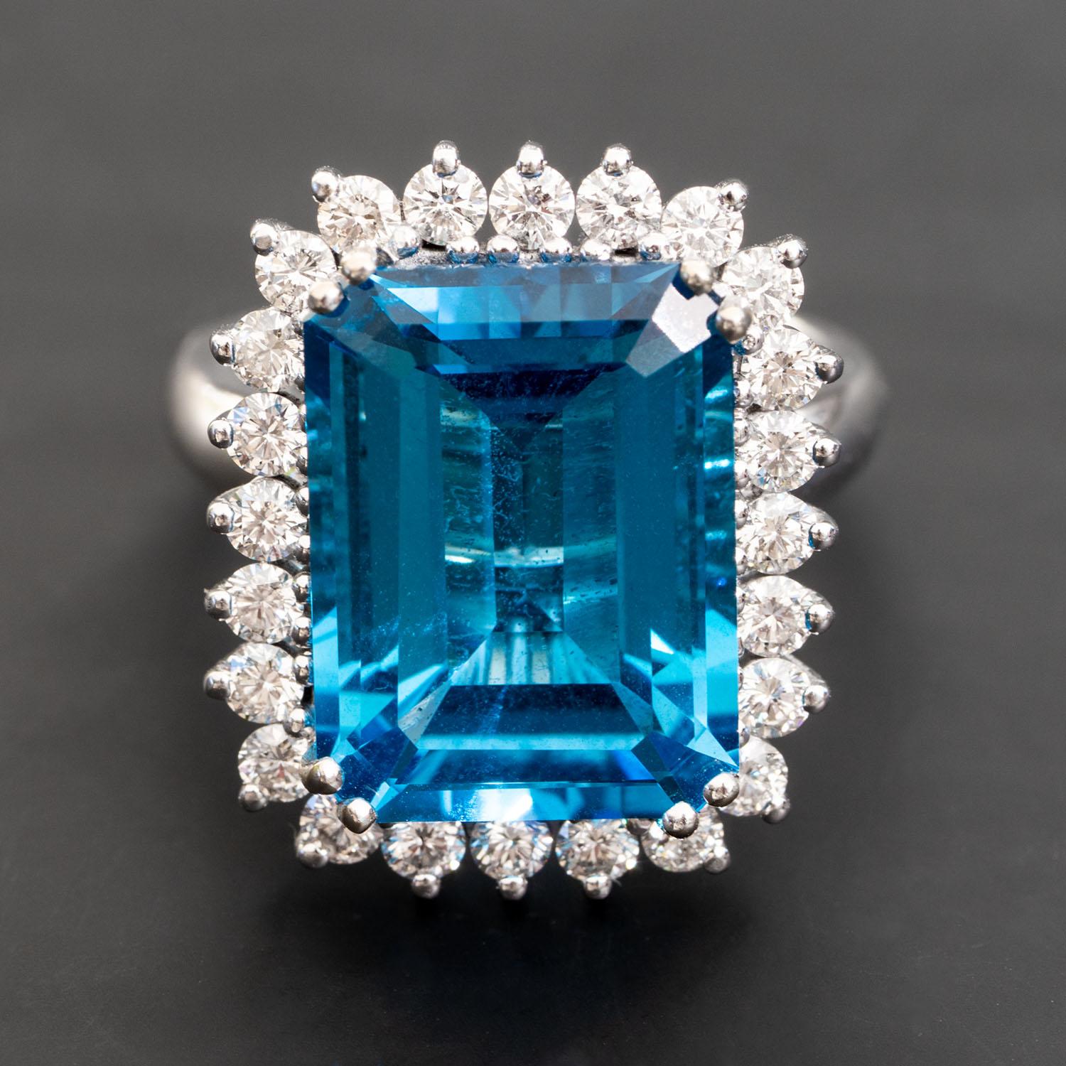 This vintage-style edge design features 1.34 carat of VS white natural diamonds, the perfect contrast to the translucent blue of this 13.00 carat natural topaz cocktail ring. The modern basket-style setting supports the gemstones in the ring’s face