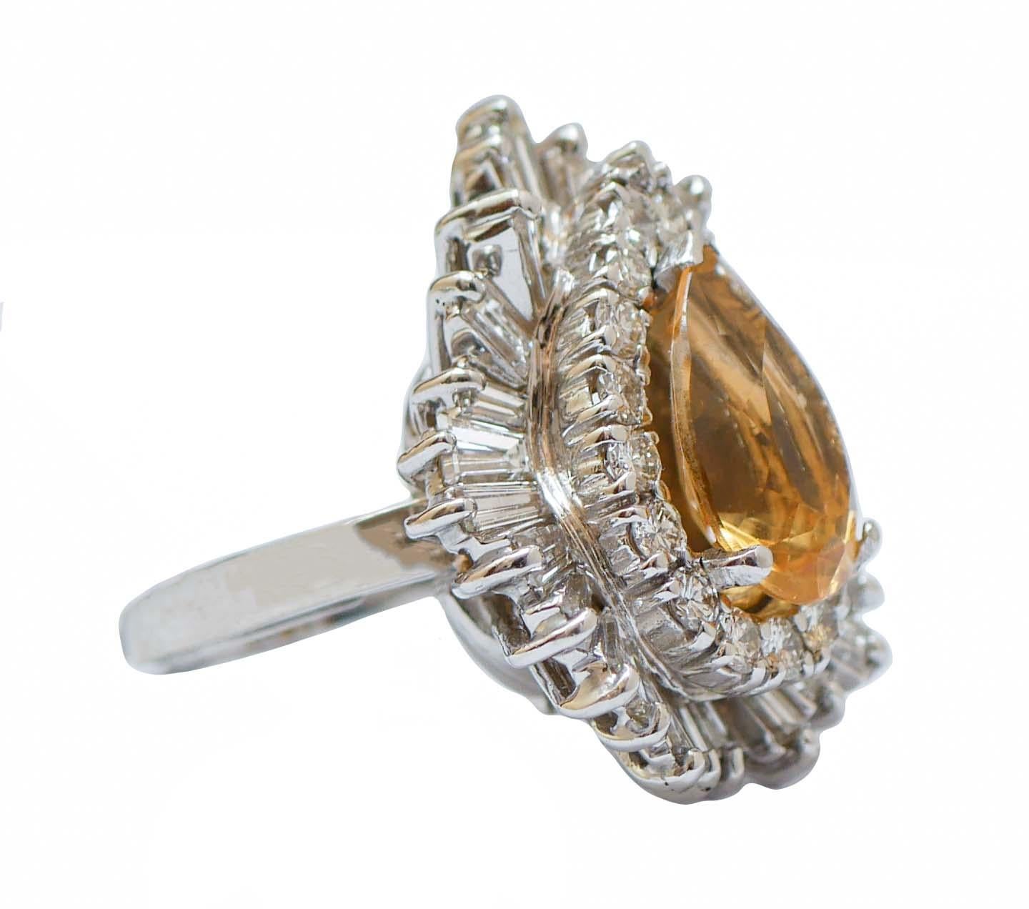 Amazing ring in 14 kt white gold structure mounted with a central drop topaz surrounded by a frame of diamonds. The particularity of this ring is due to the fact that the stem can be removed and the ring become a pendant.
This ring was totally