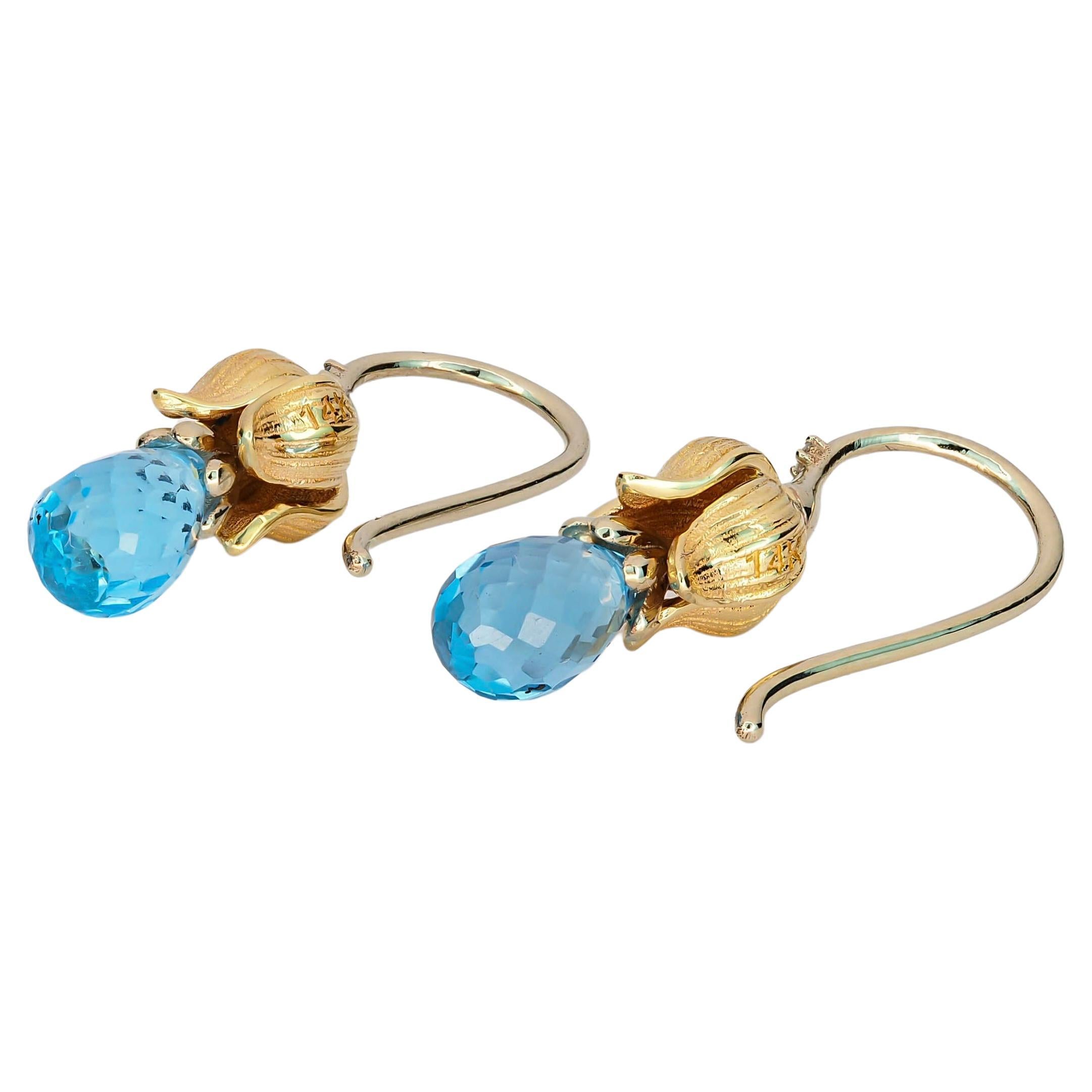 Flower design earrings with natural topaz and diamonds. November birthstone.
Gold color yellow and white - 14k marked
Weight: 3.25 g.
Size: 21 x 6 mm.
Natural topaz: 2 pieces, weight - 1.00 ct approx, sky blue color.
Briolette cut, transparent, 8.5