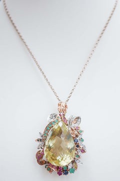 Colgante de topacio, esmeraldas, rubíes, zafiros, diamantes, oro rosa y plata.