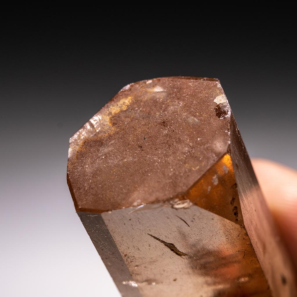 From Shigar Valley, Skardu, Baltistan, Gilgit-Baltistan, Pakistan Large single crystal of transparent sherry colored Topaz with sharp complex basal pinacoid terminations. Crystal is well formed with glassy luster faces. This 58.2g Topaz is notable