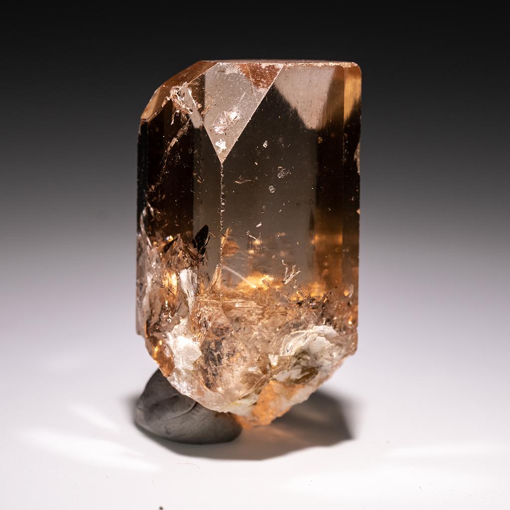 From Shigar Valley, Skardu, Baltistan, Gilgit-Baltistan, Pakistan Large single crystal of transparent sherry colored Topaz with sharp complex basal pinacoid terminations. Crystal is well formed with glassy luster faces. This Topaz crystal is