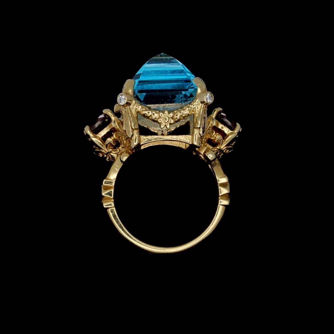 Women's 9 Karat Yellow Gold Ring with Blue Topaz, Garnets and Diamonds For Sale